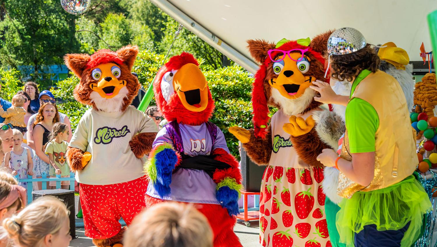 Mikkelparken mascots entertaining children during a family show