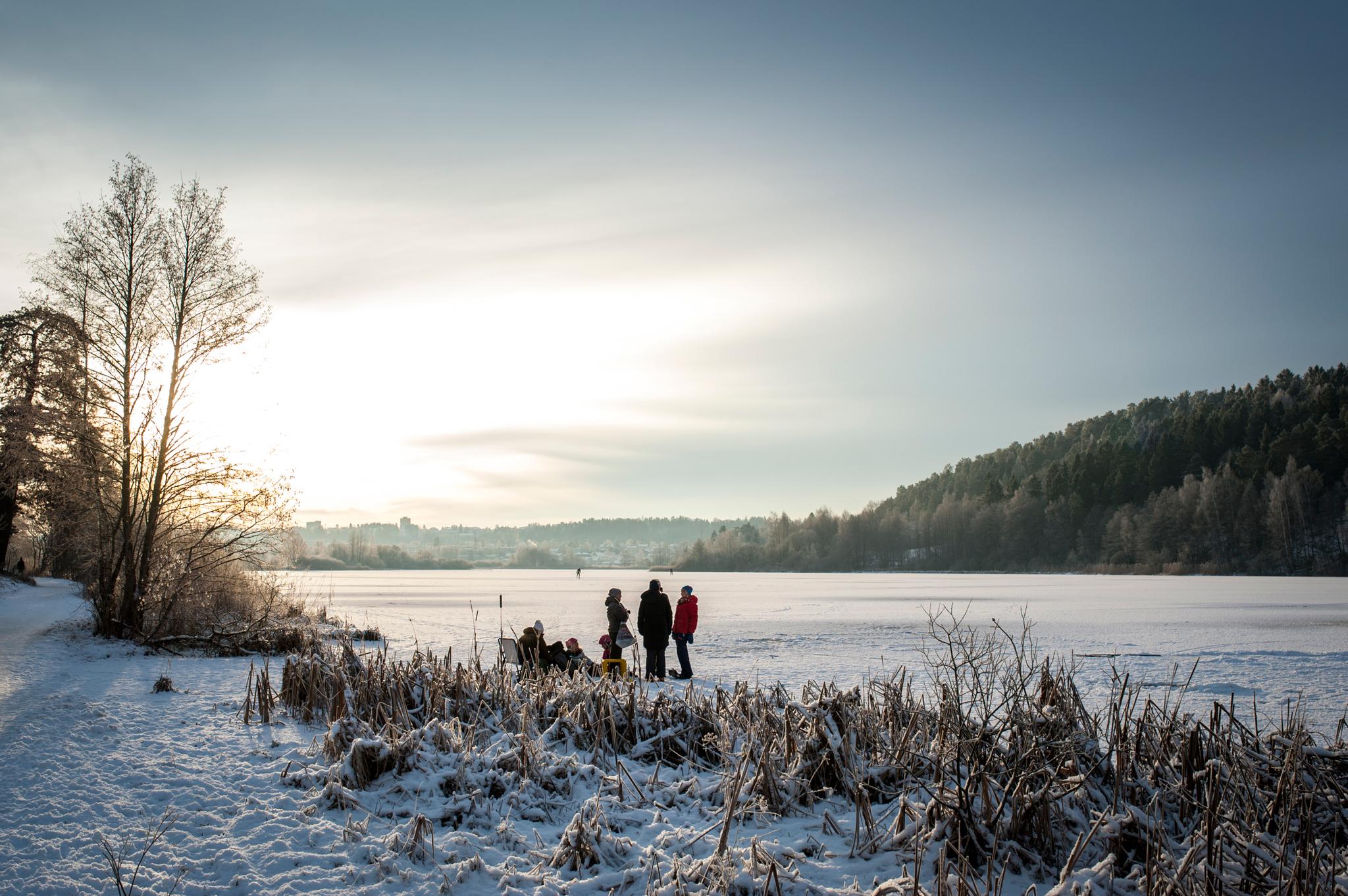 people walking on the ice-covered water