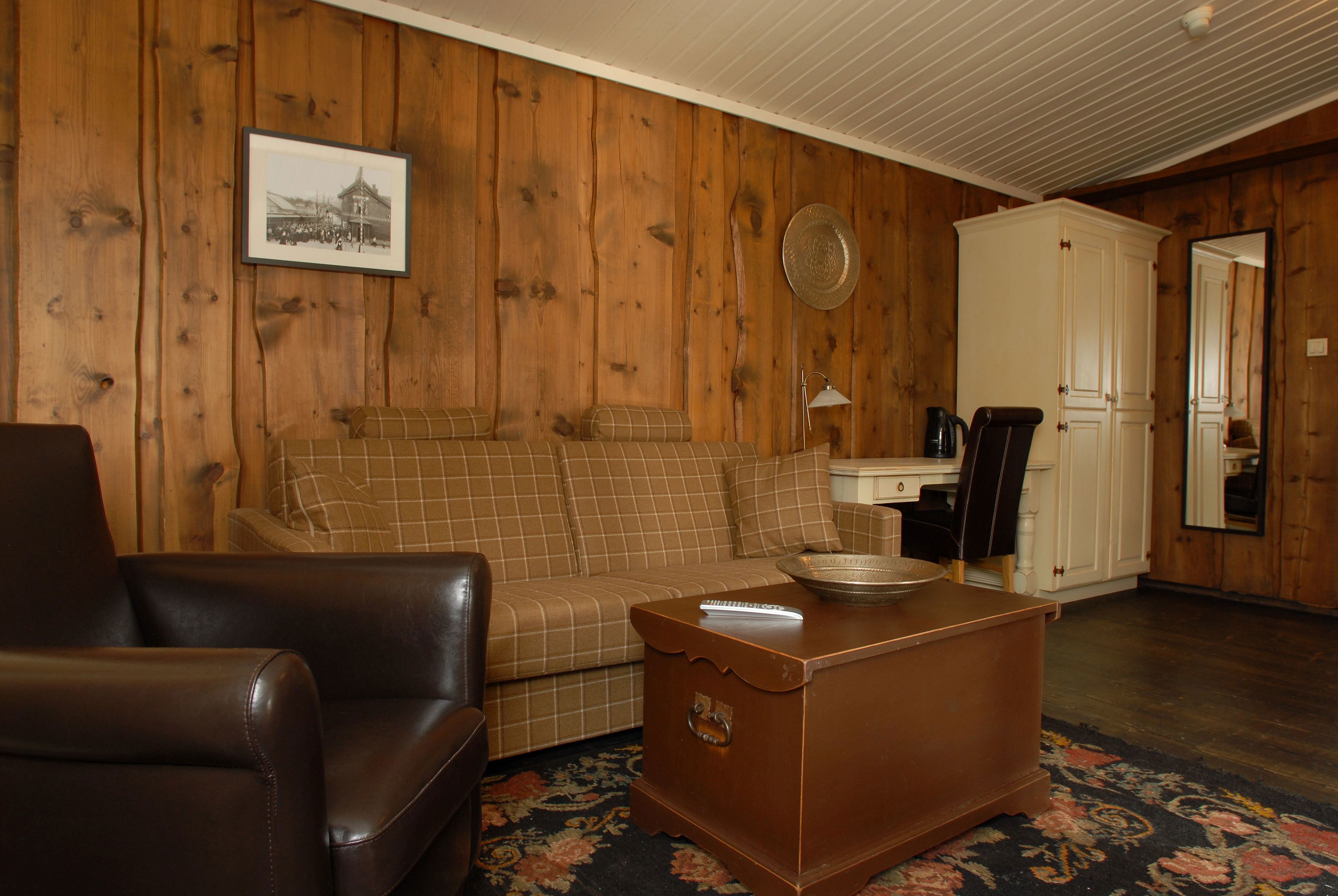Honeymoon suite with living room with sofa and coffee table.