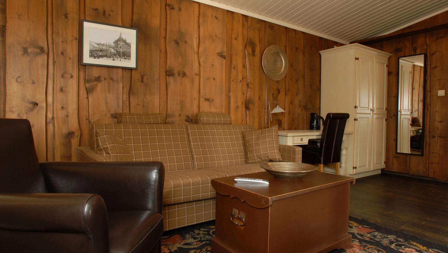 Honeymoon suite with living room with sofa and coffee table.