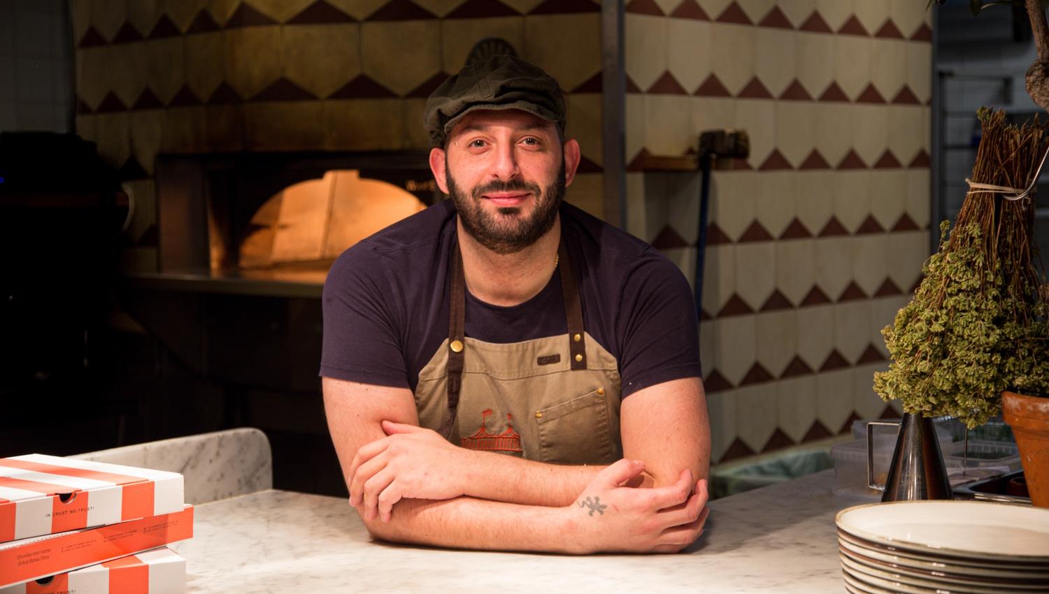 Happy pizza baker