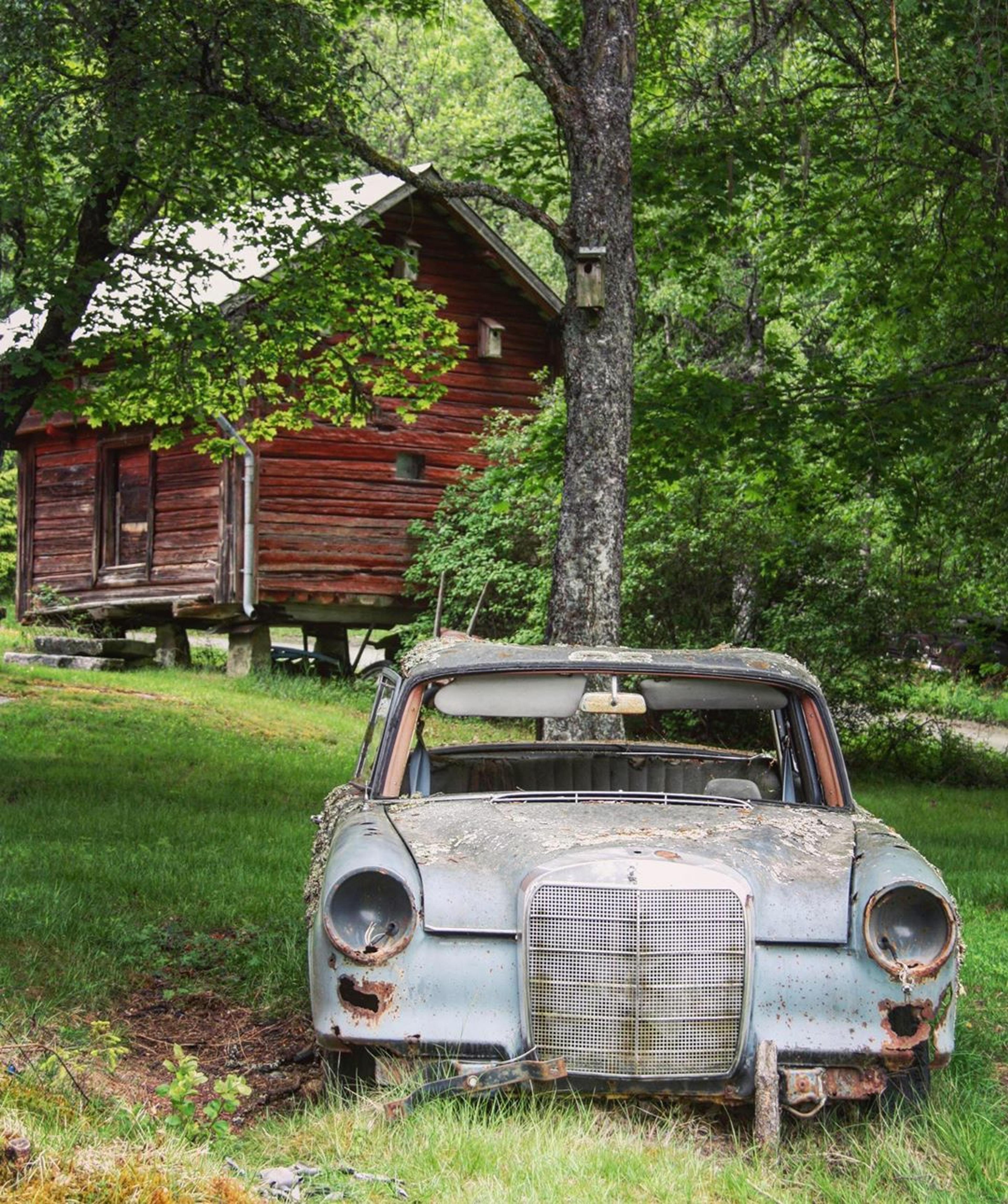An old car in front of an old building