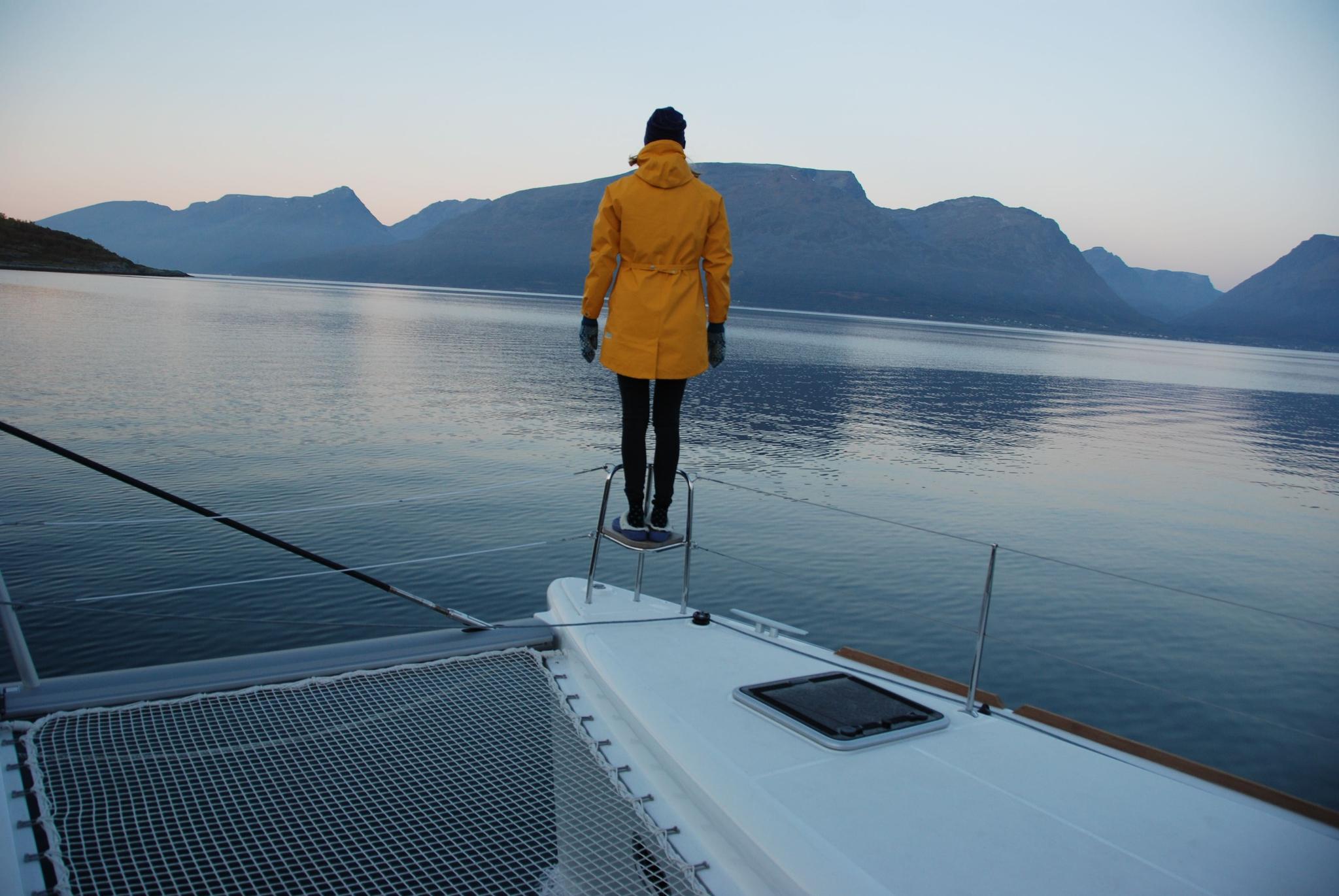 Guest looking out to sea from sailboat
