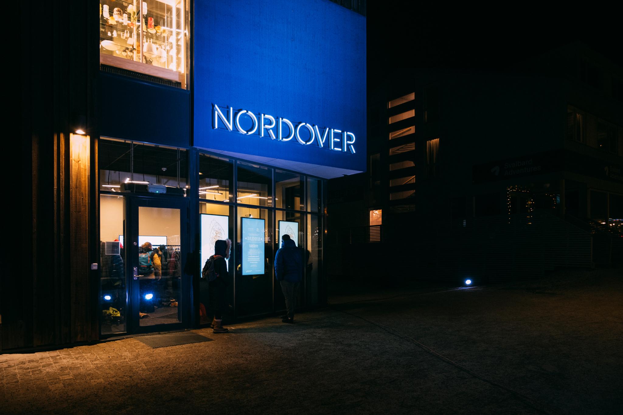 Persons outside the entrance door to Nordover