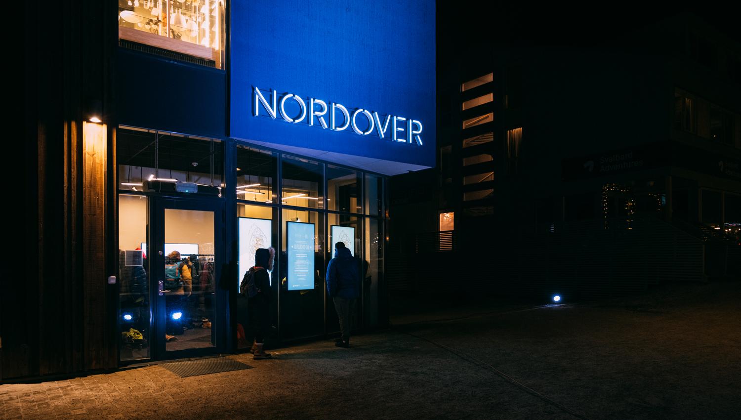 Persons outside the entrance door to Nordover