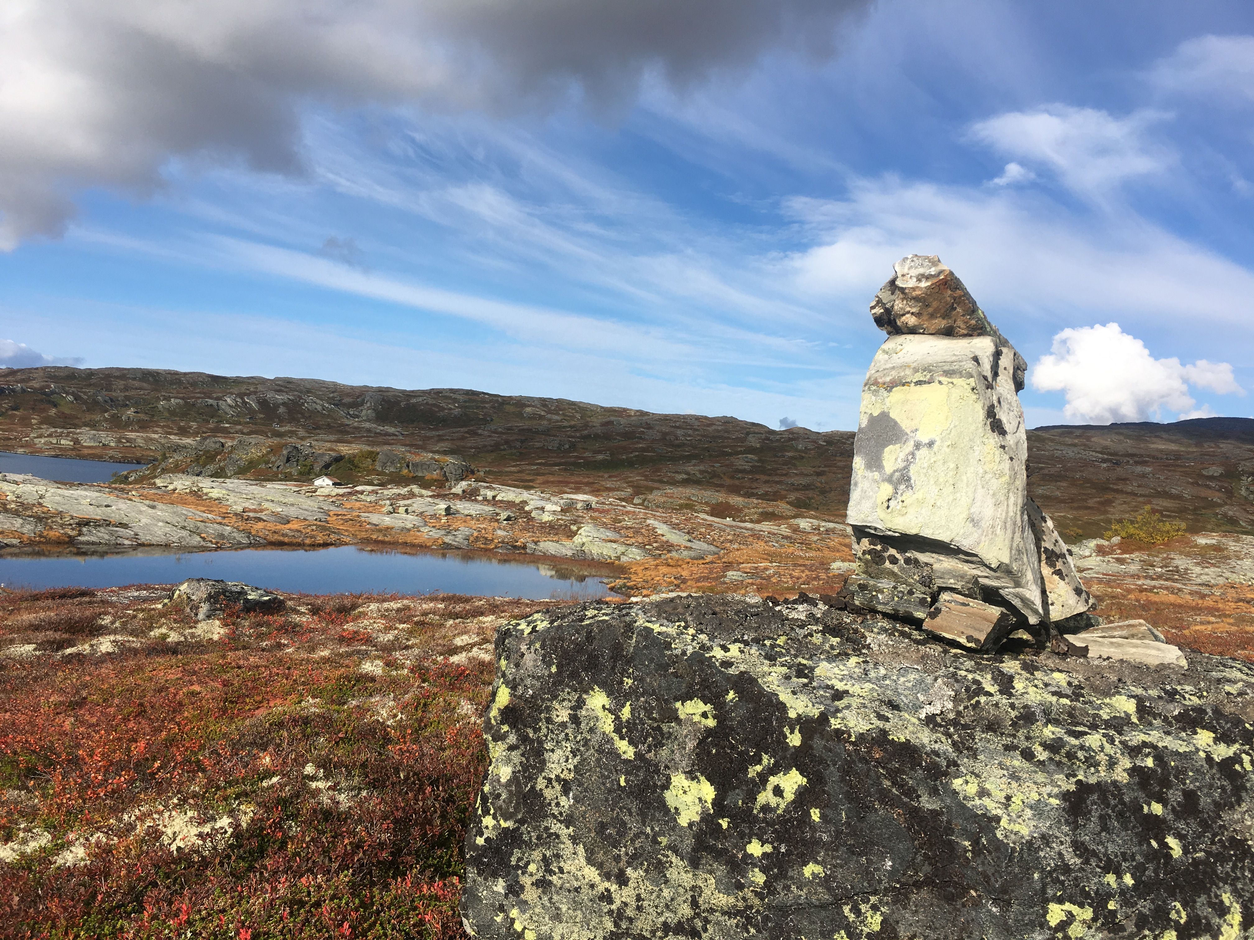 Rock formation and calm mountain landscape with lakes on Hardangervidda.