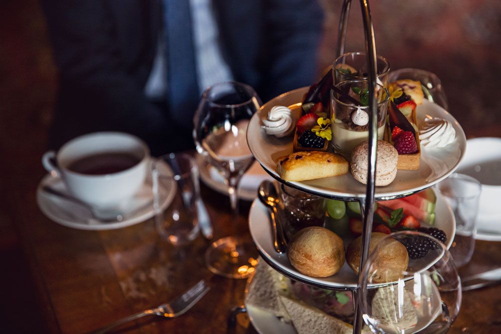 cake, fruit and sandwiches for afternoon tea