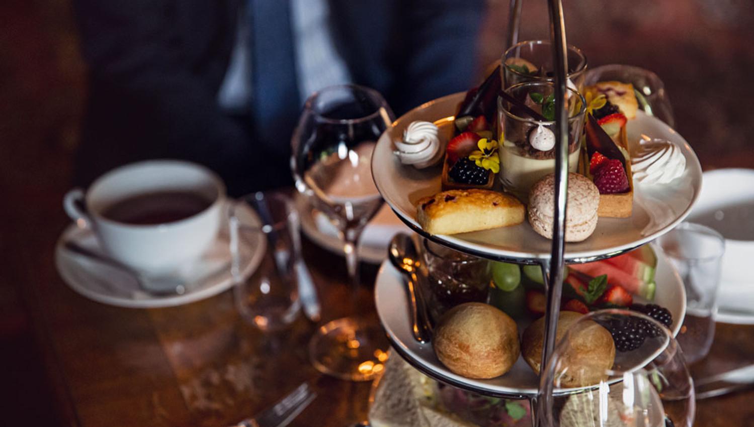 cake, fruit and sandwiches for afternoon tea