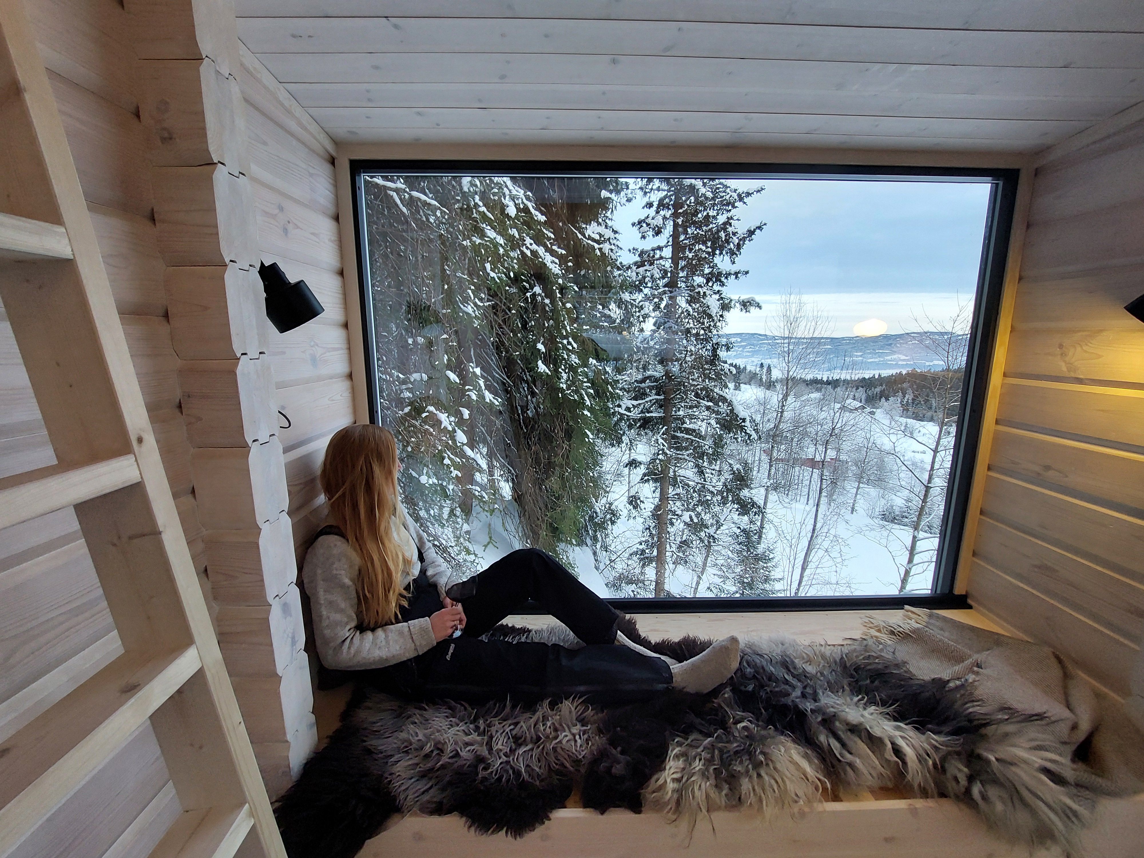woman looking out of a window 