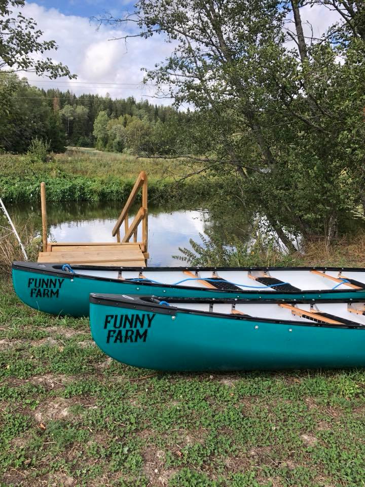 Two canoes with the Funny farm logo