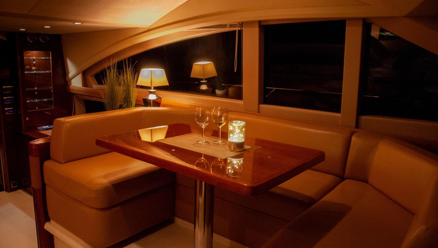Private yacht cruise in the Bergen area, inside the salon after dark
