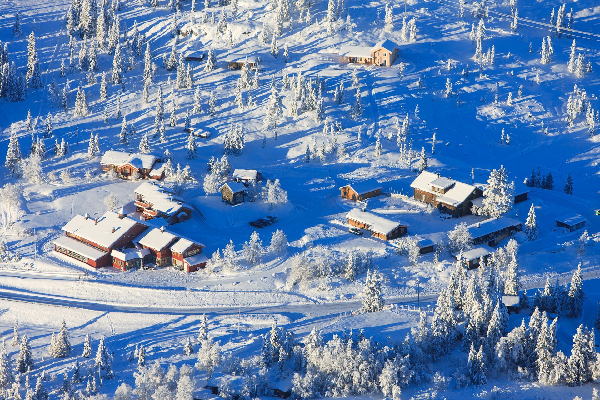 "Nythun" surrounded with snow from a birds view on a beautiful day