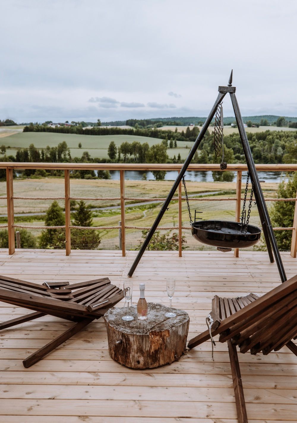 view from a terrace with a barbeque and some charis 