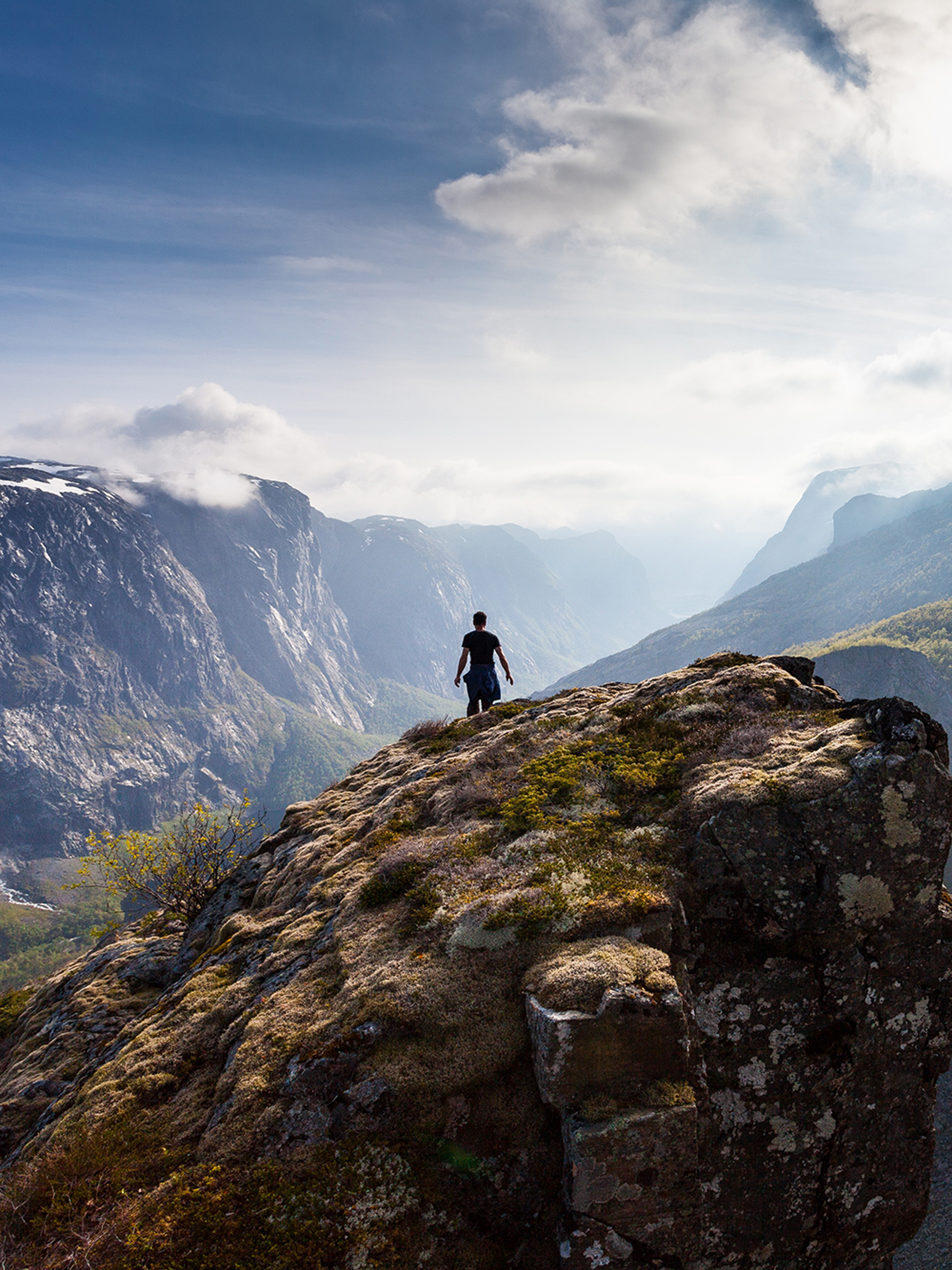 Person on rock formation near Fossjuvet in Forsand, Fjord Norway