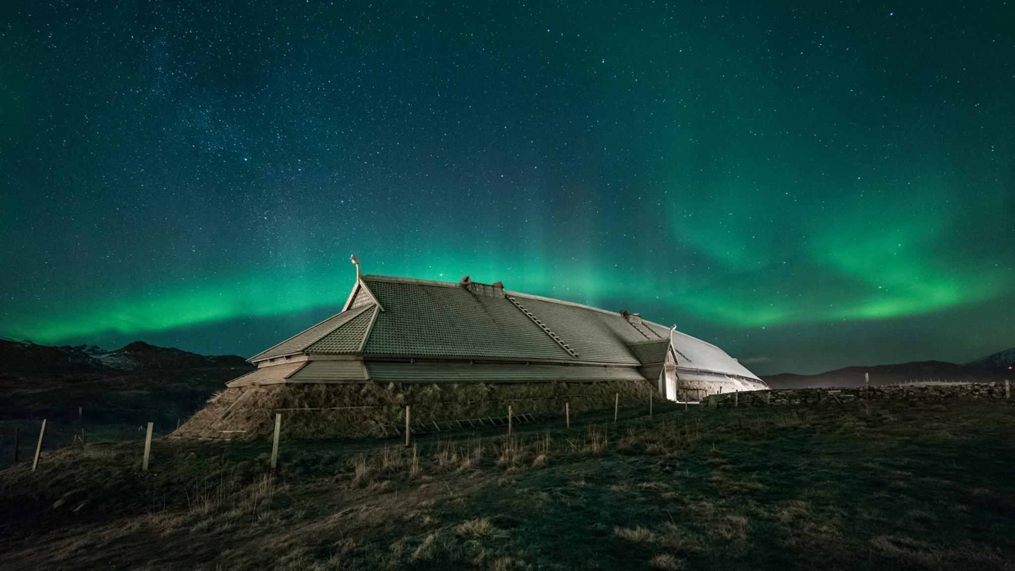 Viking longhouse under northern lights in Borg in Lofoten