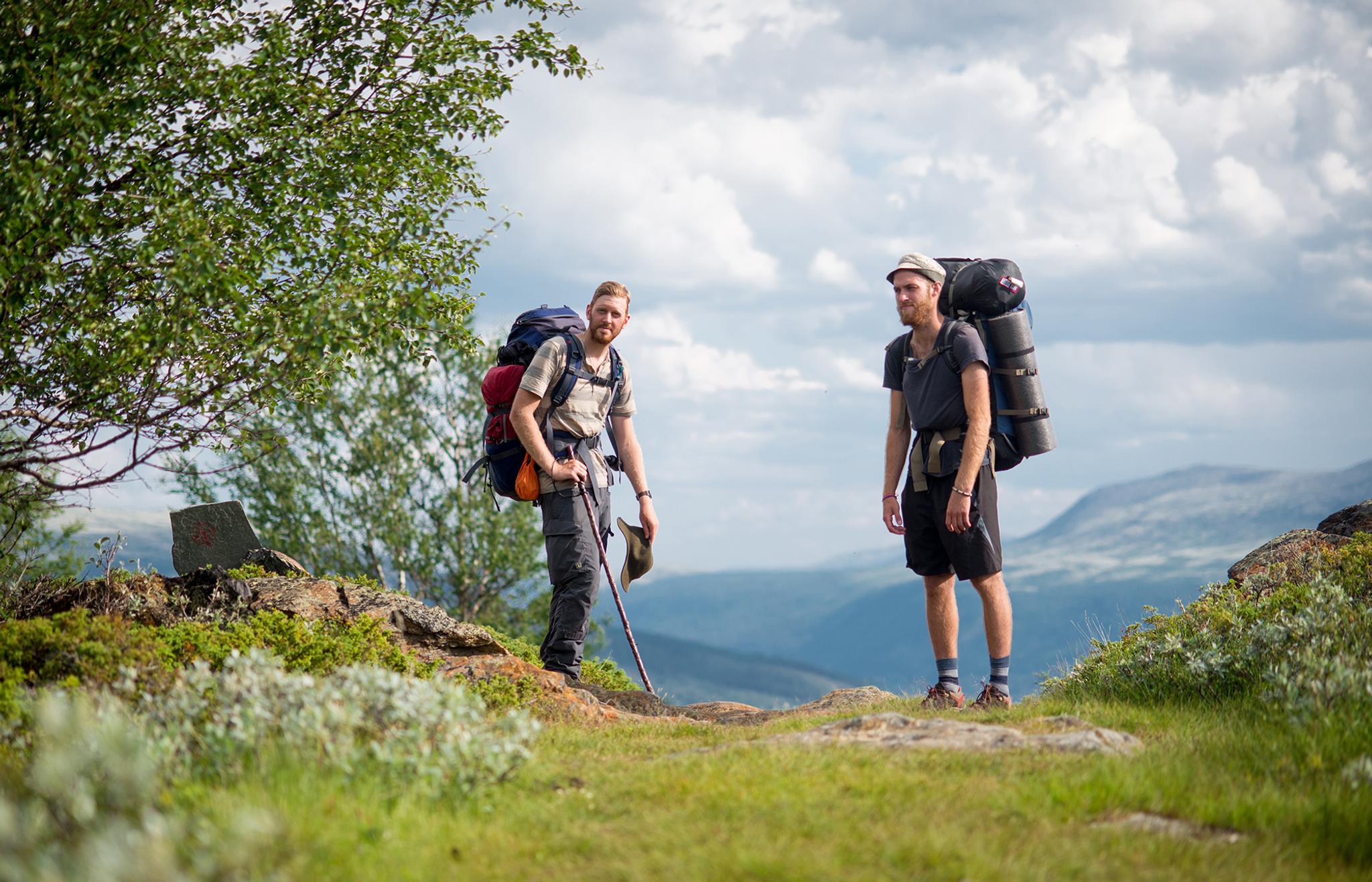 Two man with backpacks during a pilgrimage in Dovrefjell, Eastern Norway