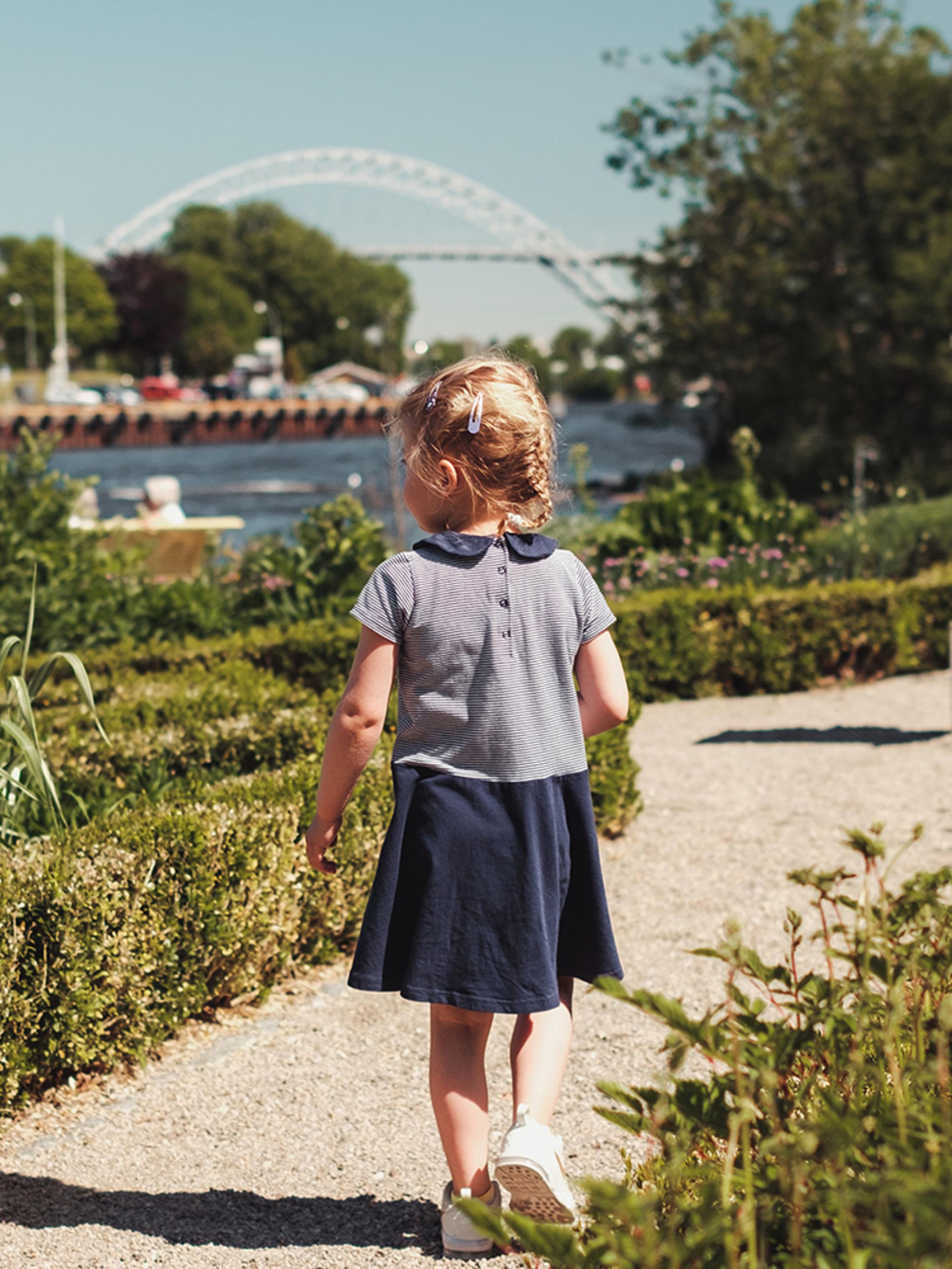 A girl walking in a garden on the island Isegran in Fredrikstad, Eastern Norway