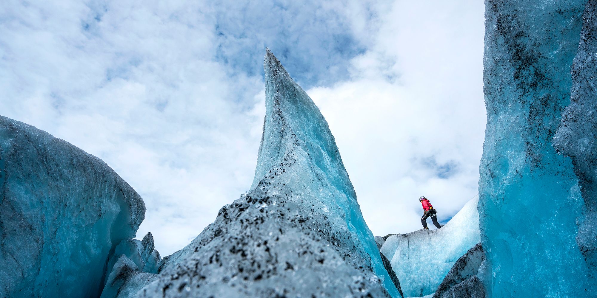 A person is hiking on the Nigardsbreen glacier in the Jostedalen valley in the Sognefjord area of Fjord Norway