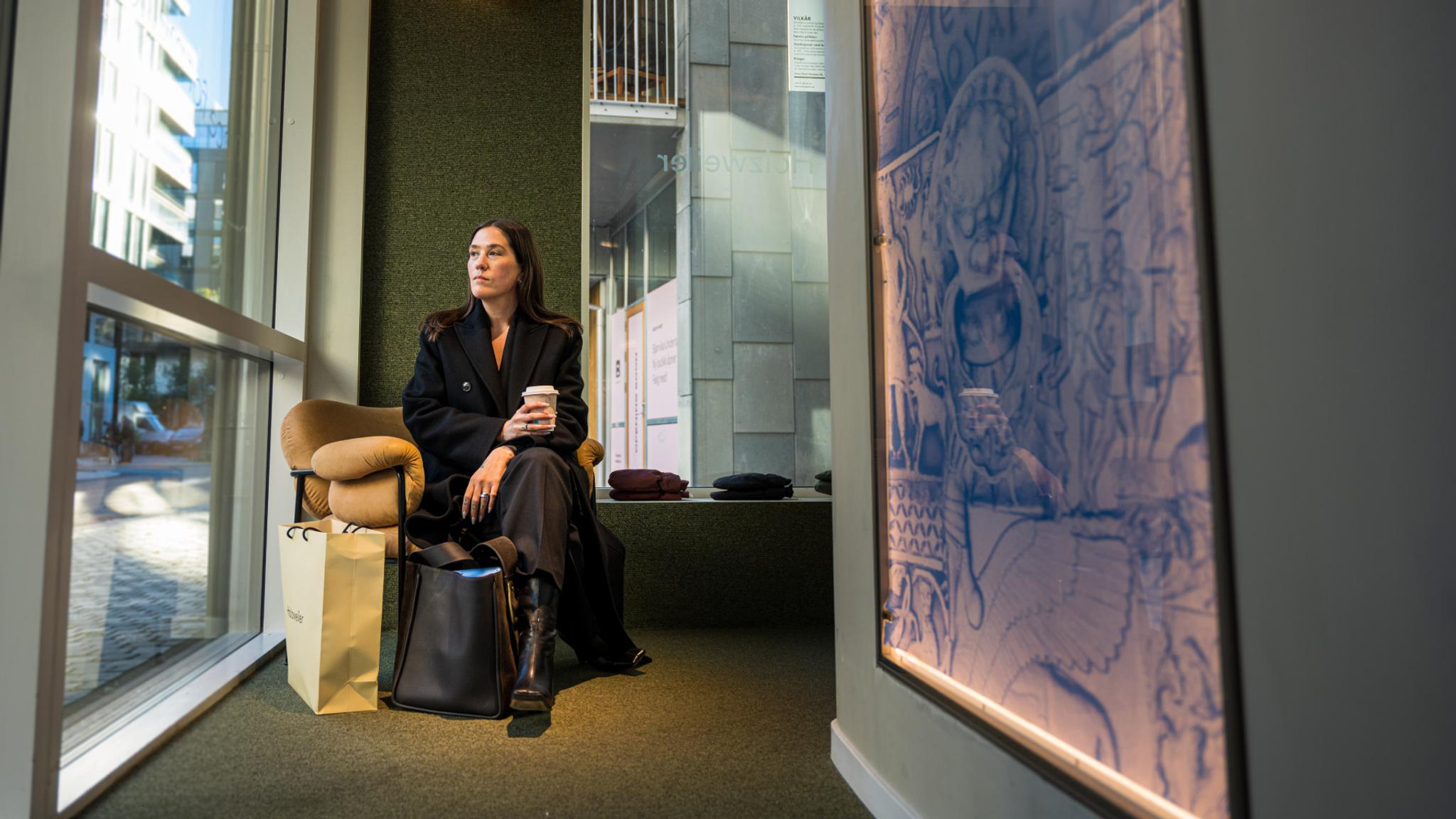 Ida Elise Eide Einarsdottir sitting in a chair in the Holzweiler Platz store