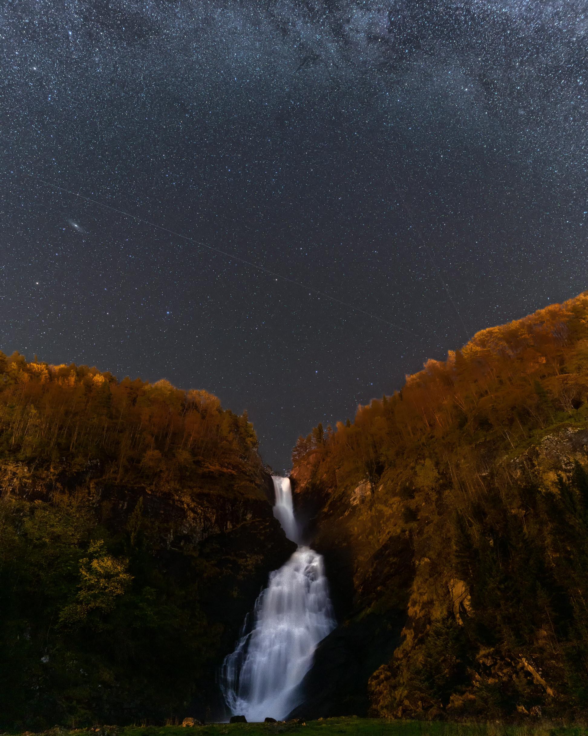 A waterfall under a starry night