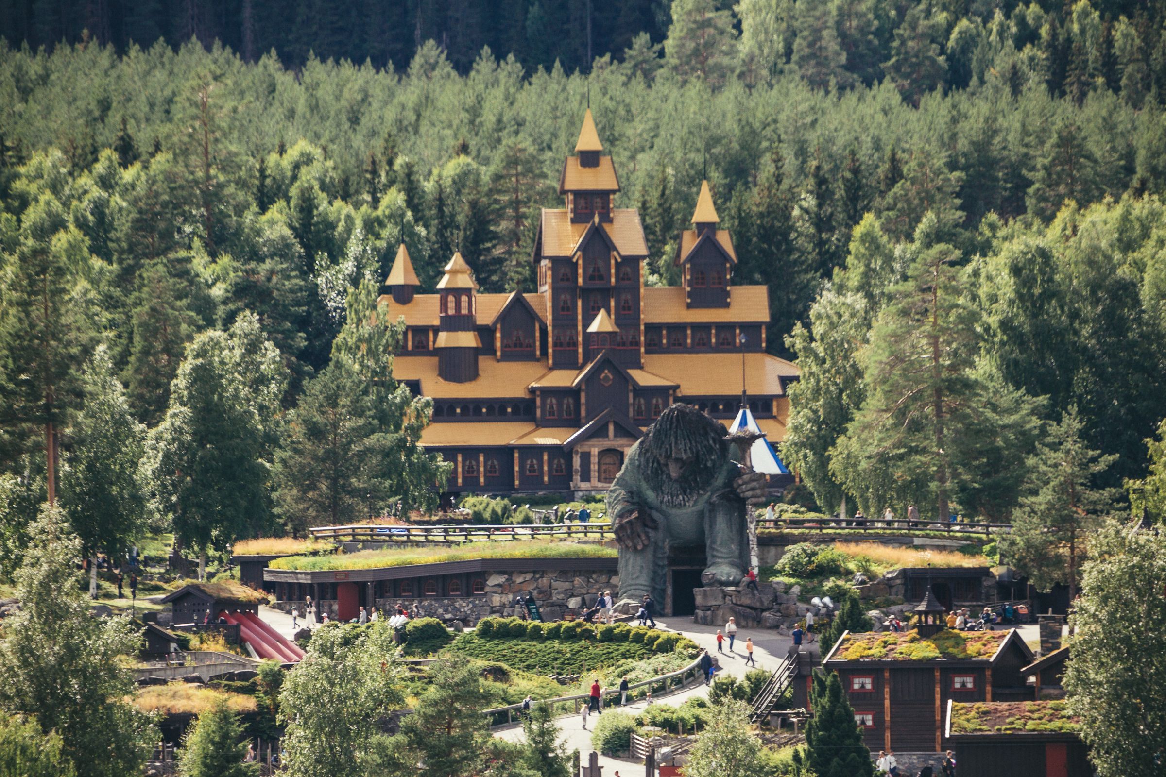 A view of Hunderfossen fairytale park with the Hunderfossen troll in front of the fairytale castle