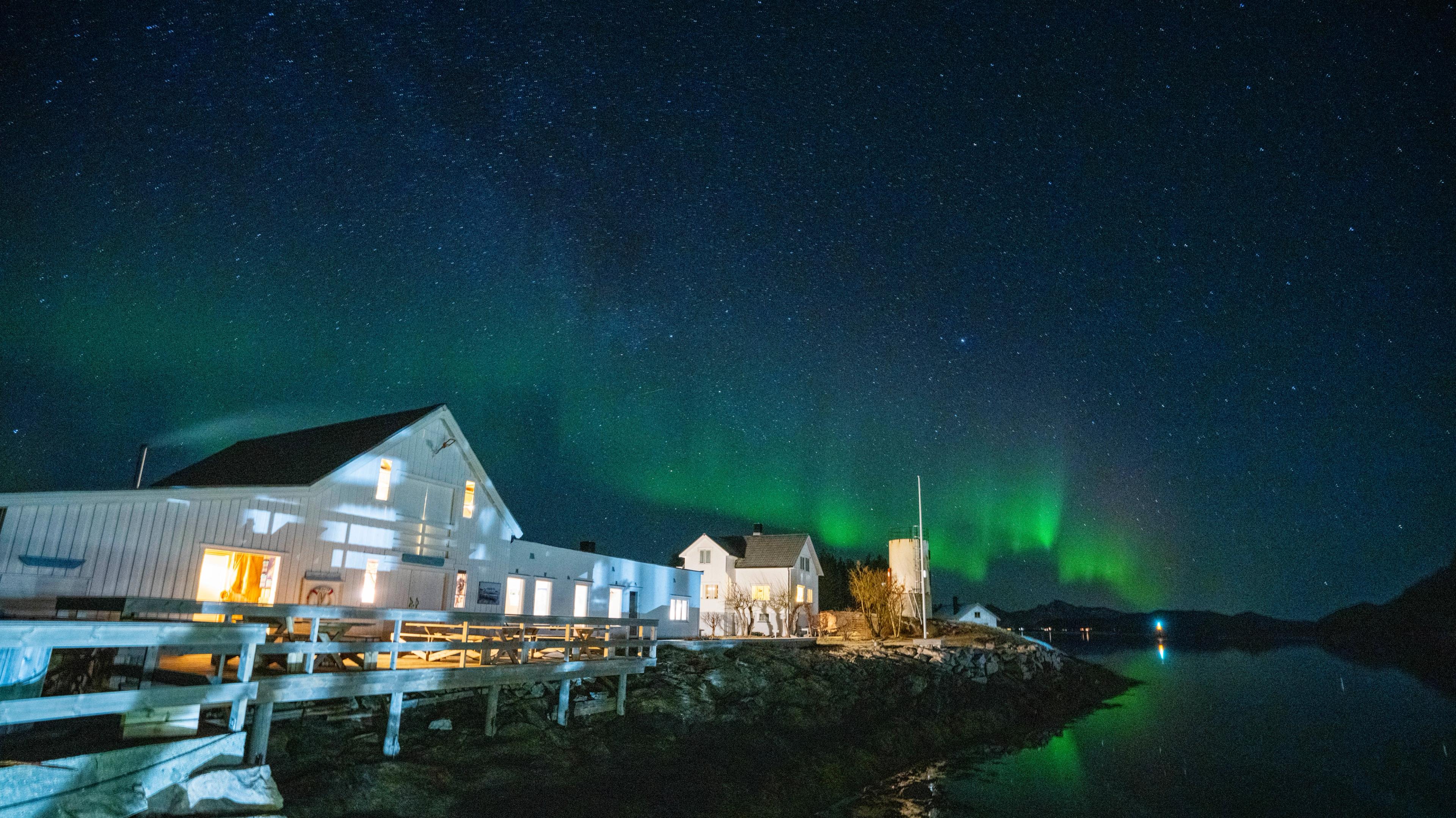 Northern lights over Naustholmen houses.