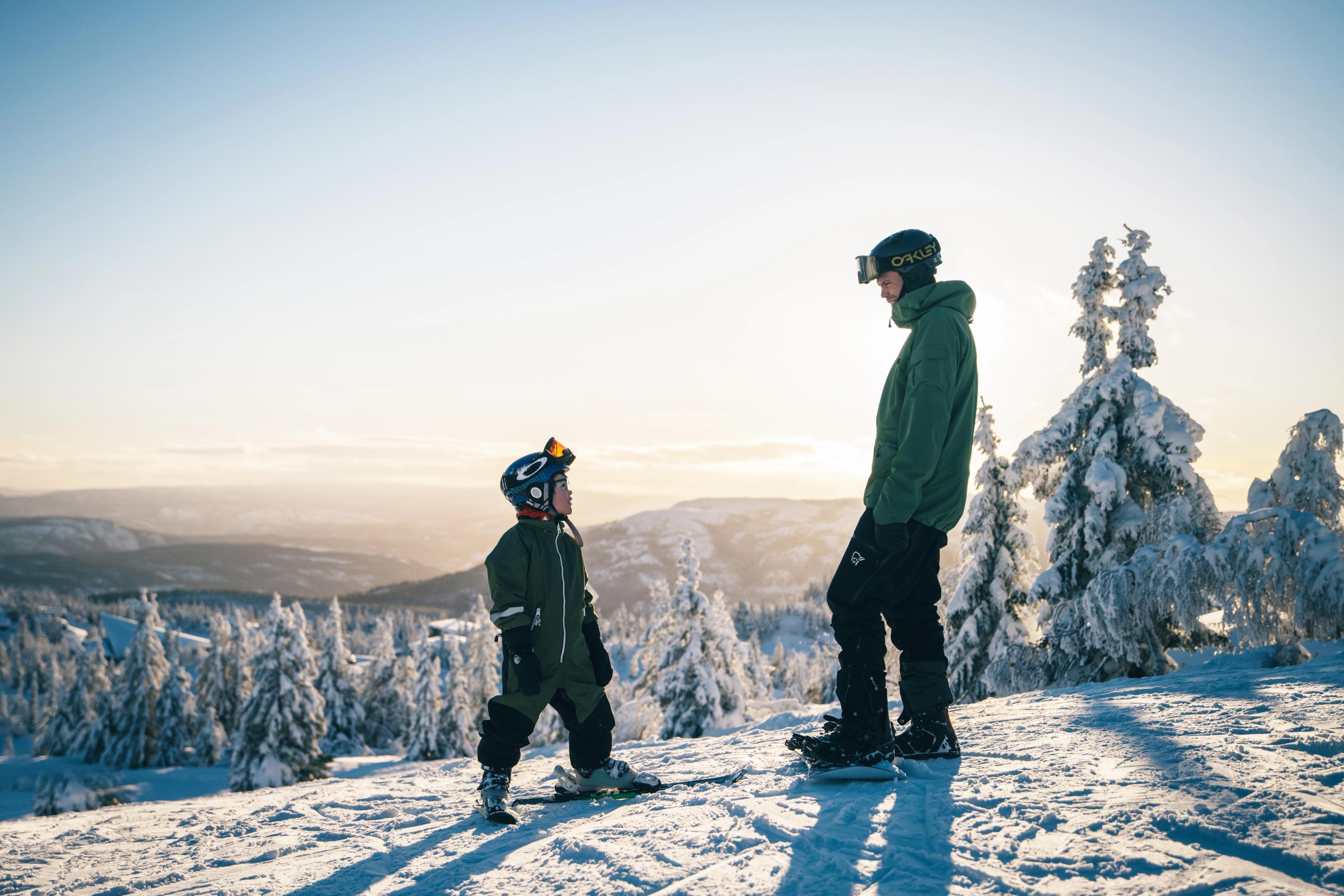 Kid and man skiing at Lifjell ski resort