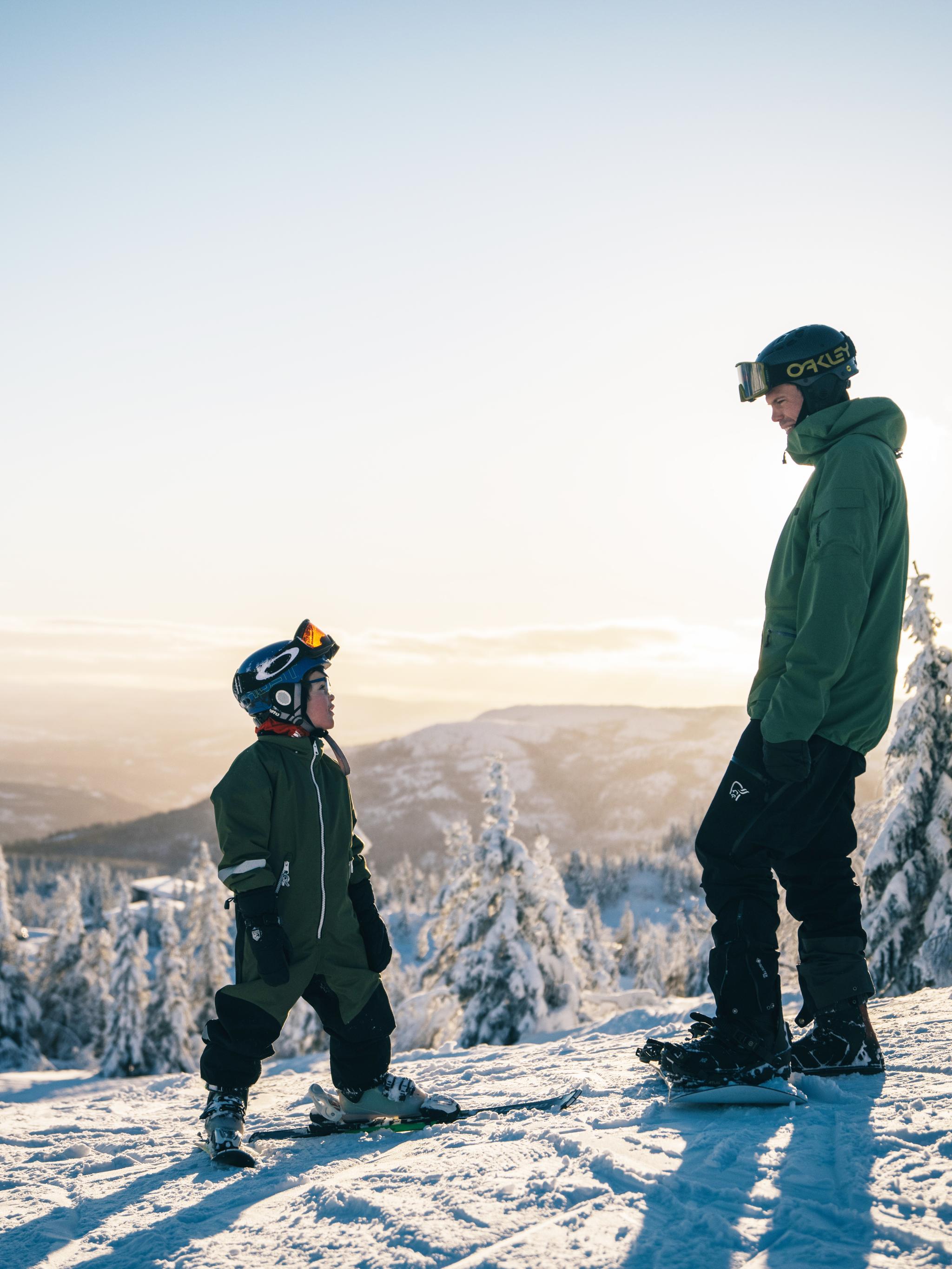 Kid and man skiing at Lifjell ski resort