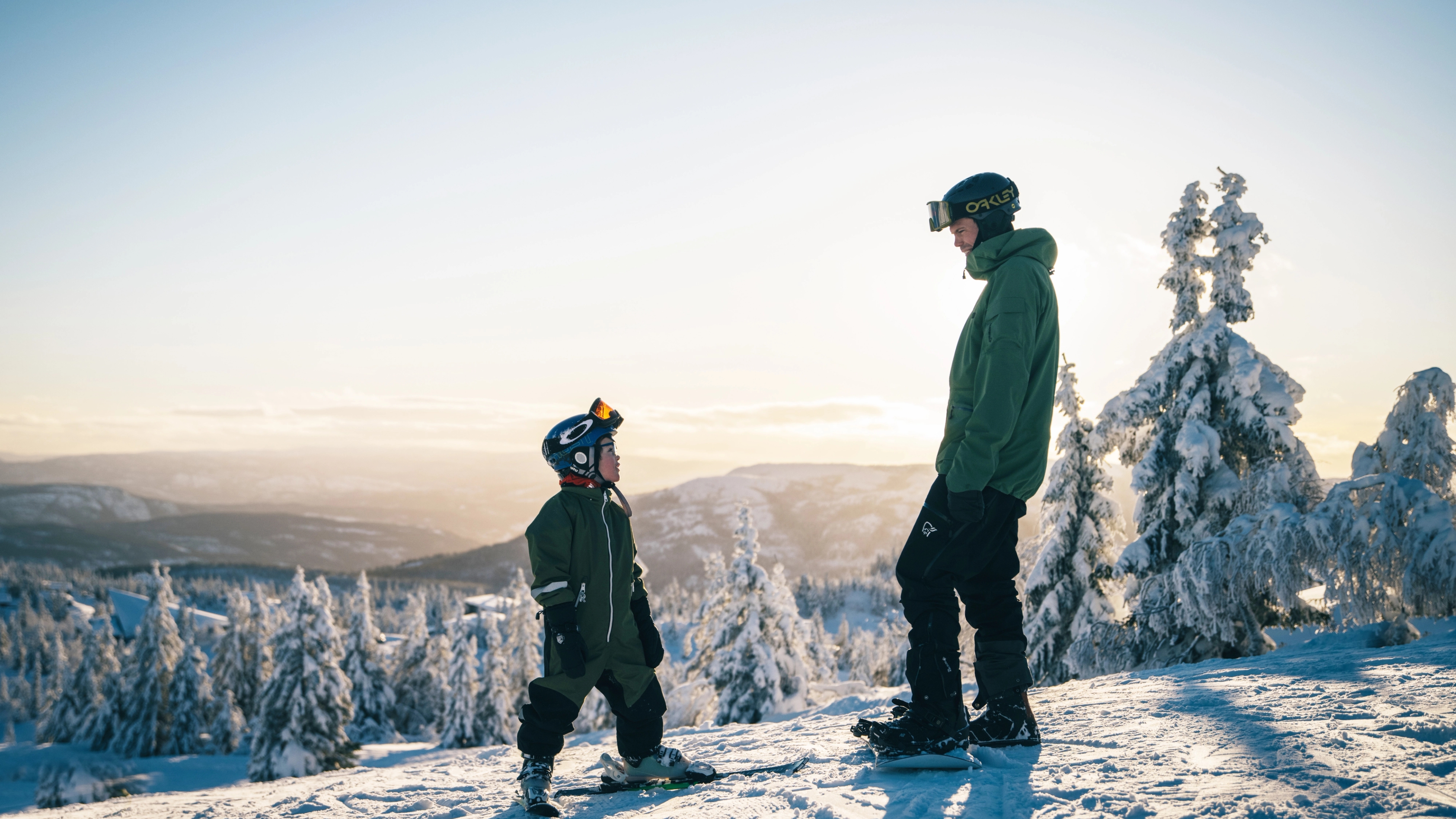 Kid and man skiing at Lifjell ski resort
