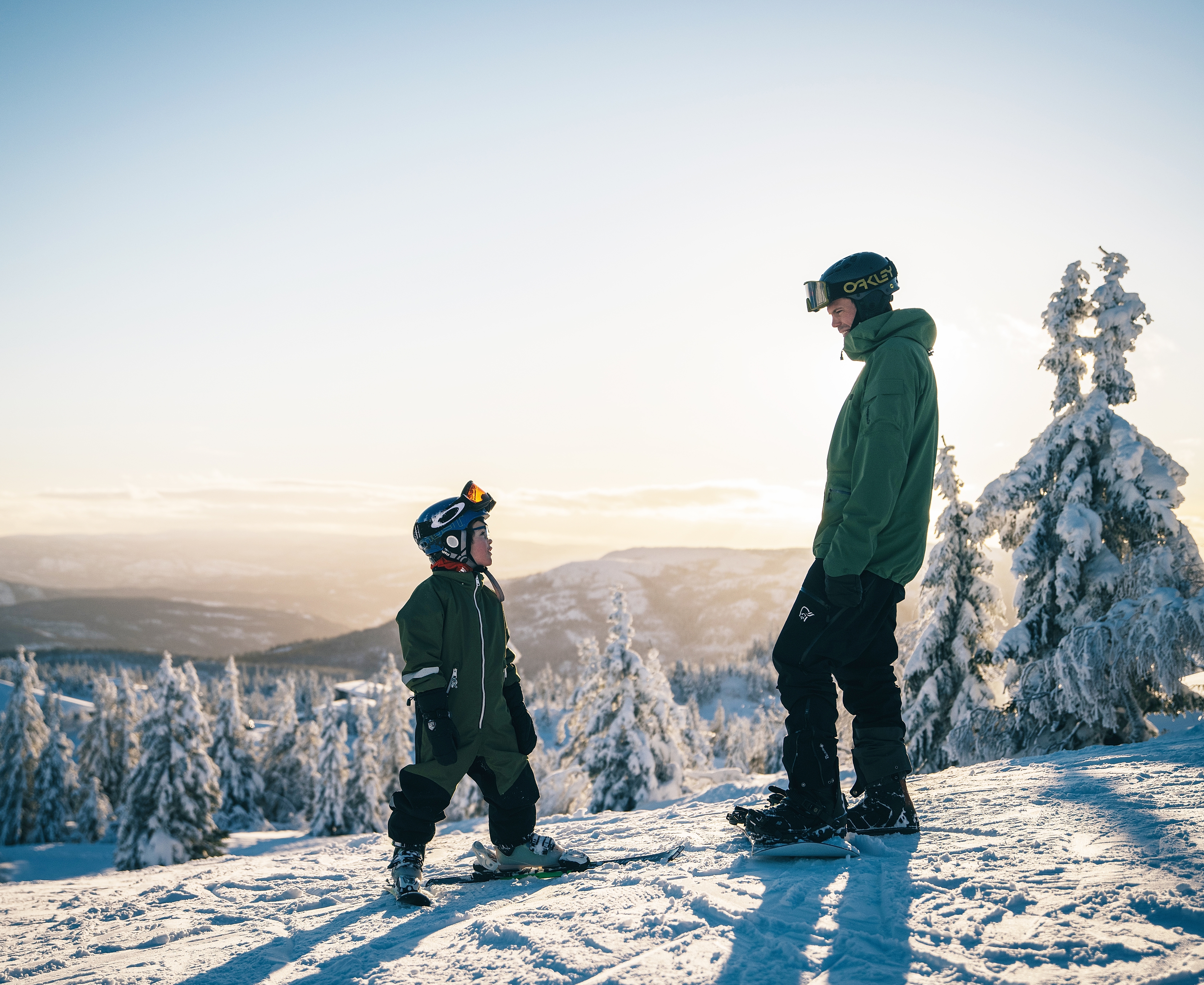 Kid and man skiing at Lifjell ski resort