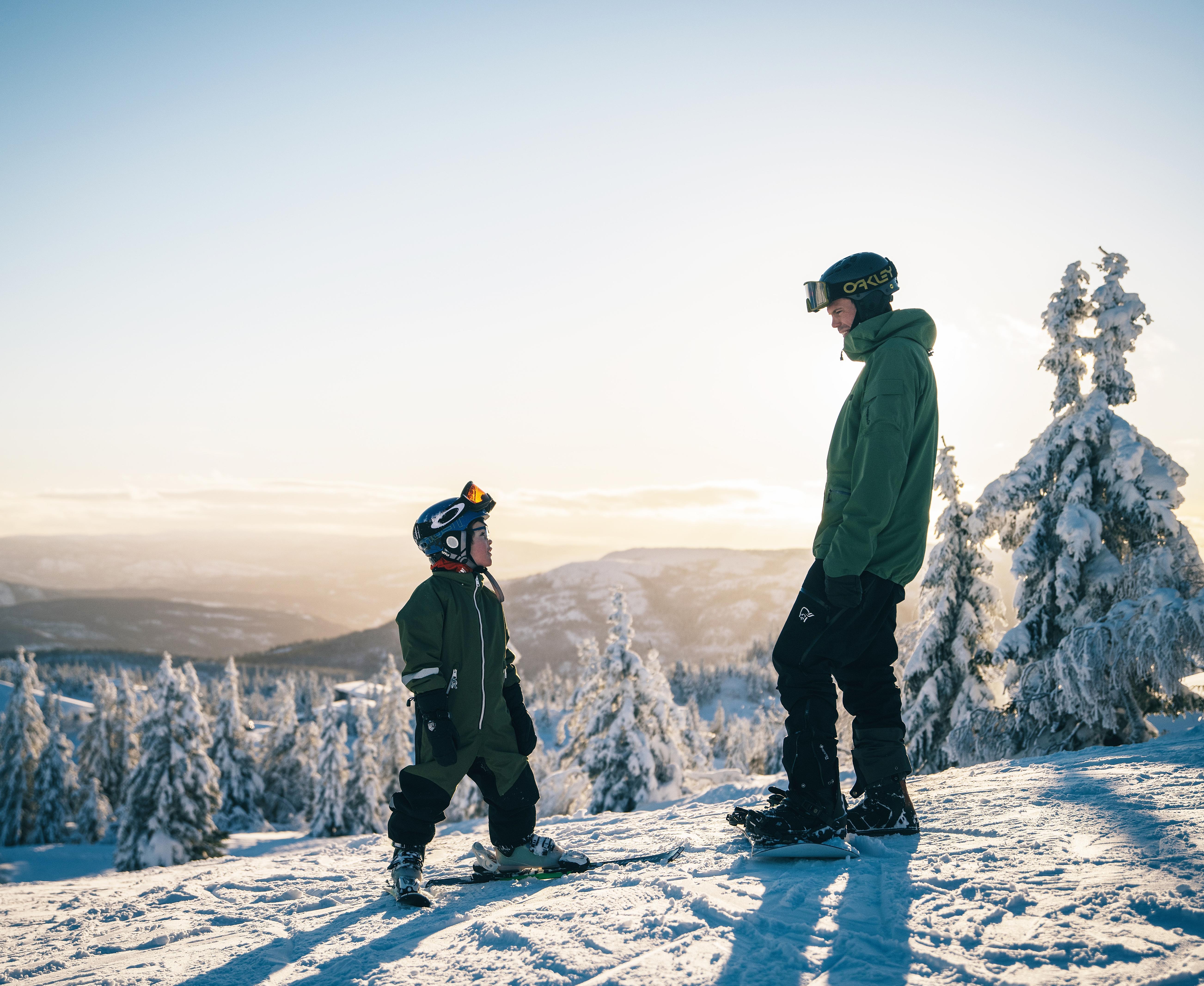 Kid and man skiing at Lifjell ski resort