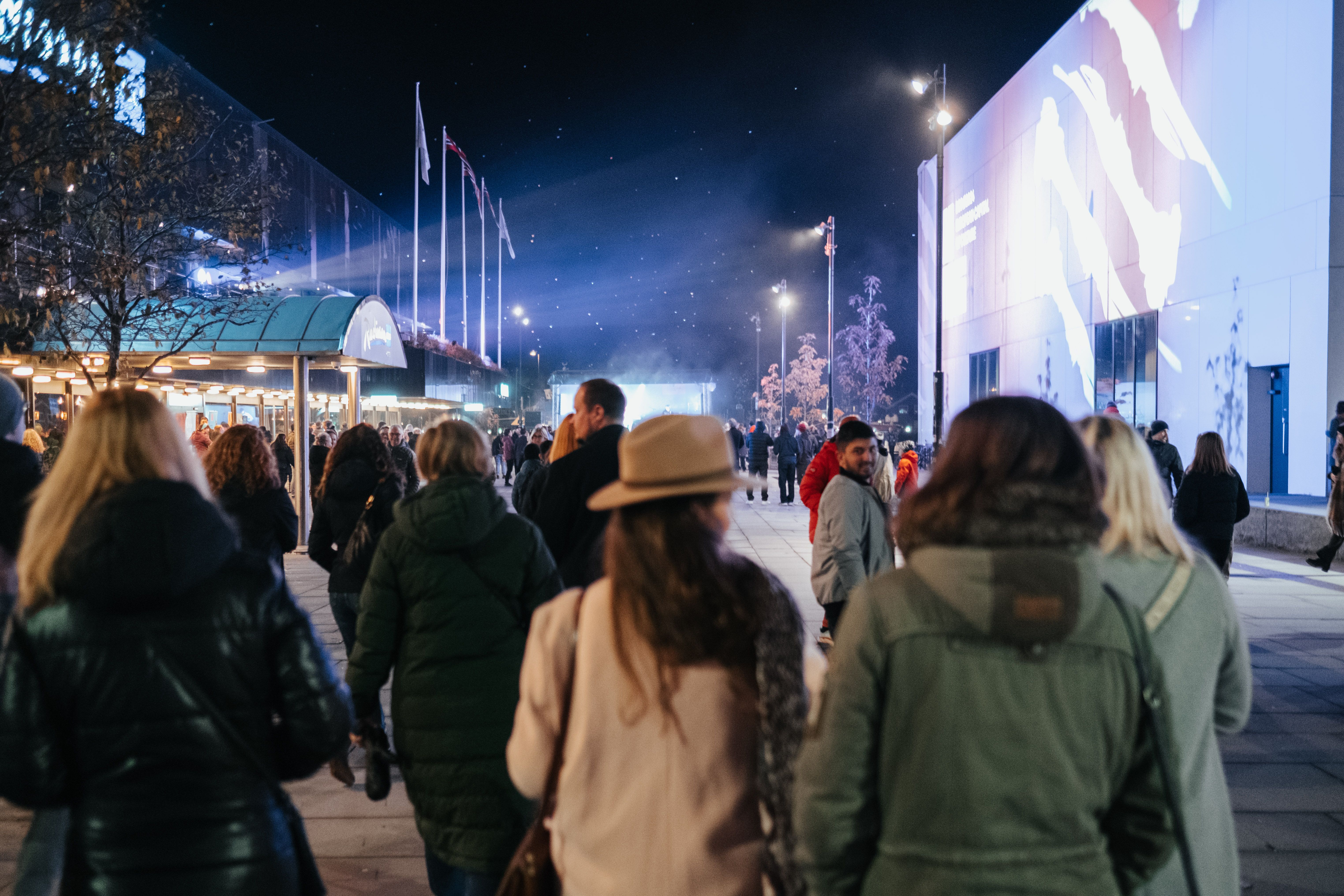 People are walking in the streets of Bodø in winter on a cultural event