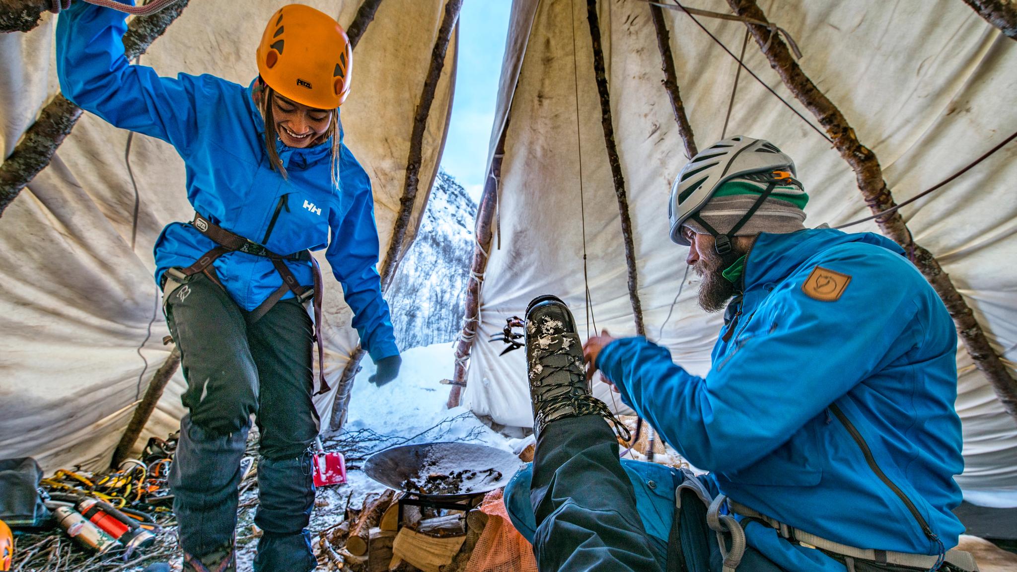 Three iceclimbers in a lavvo