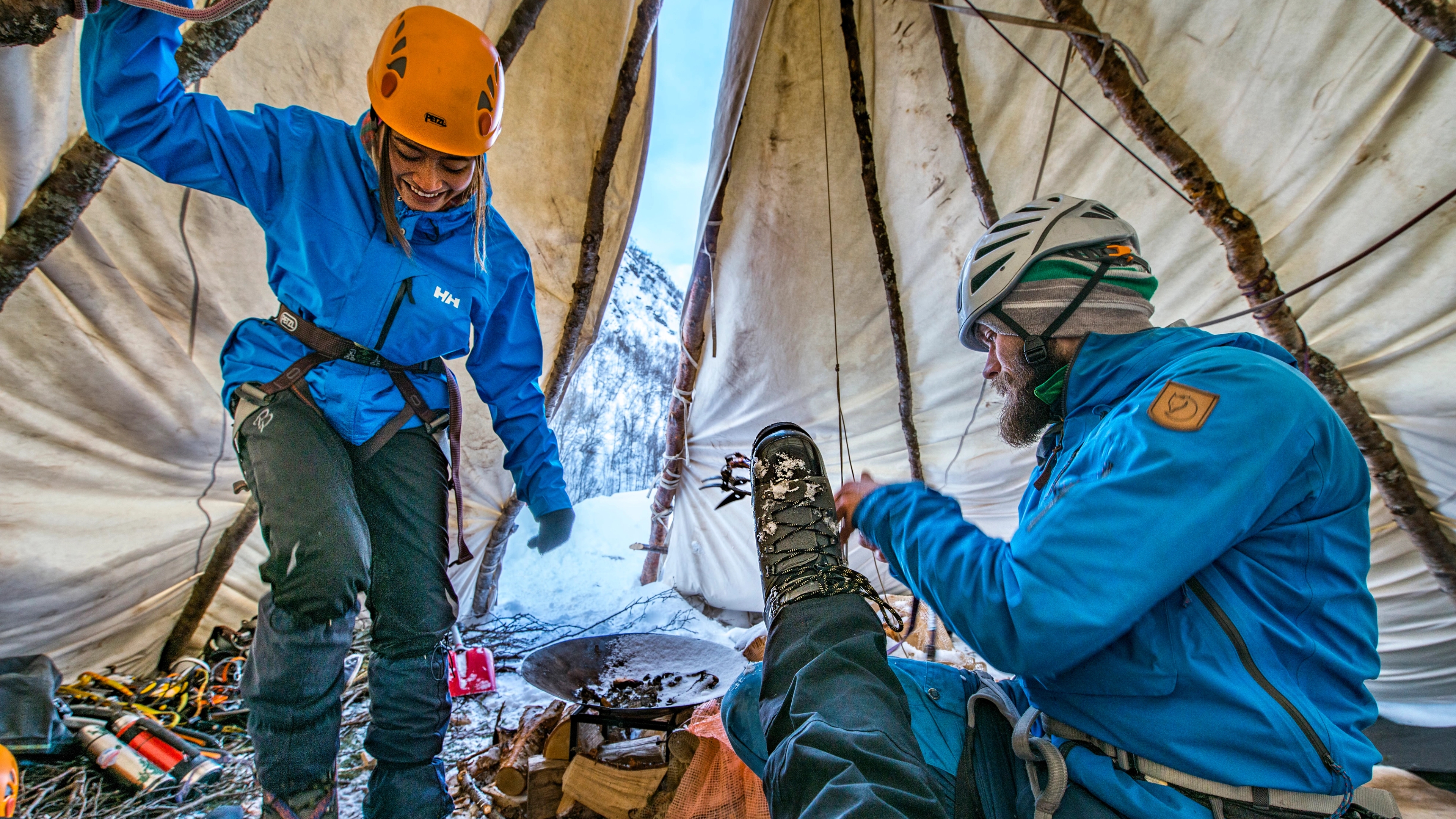 Three iceclimbers in a lavvo