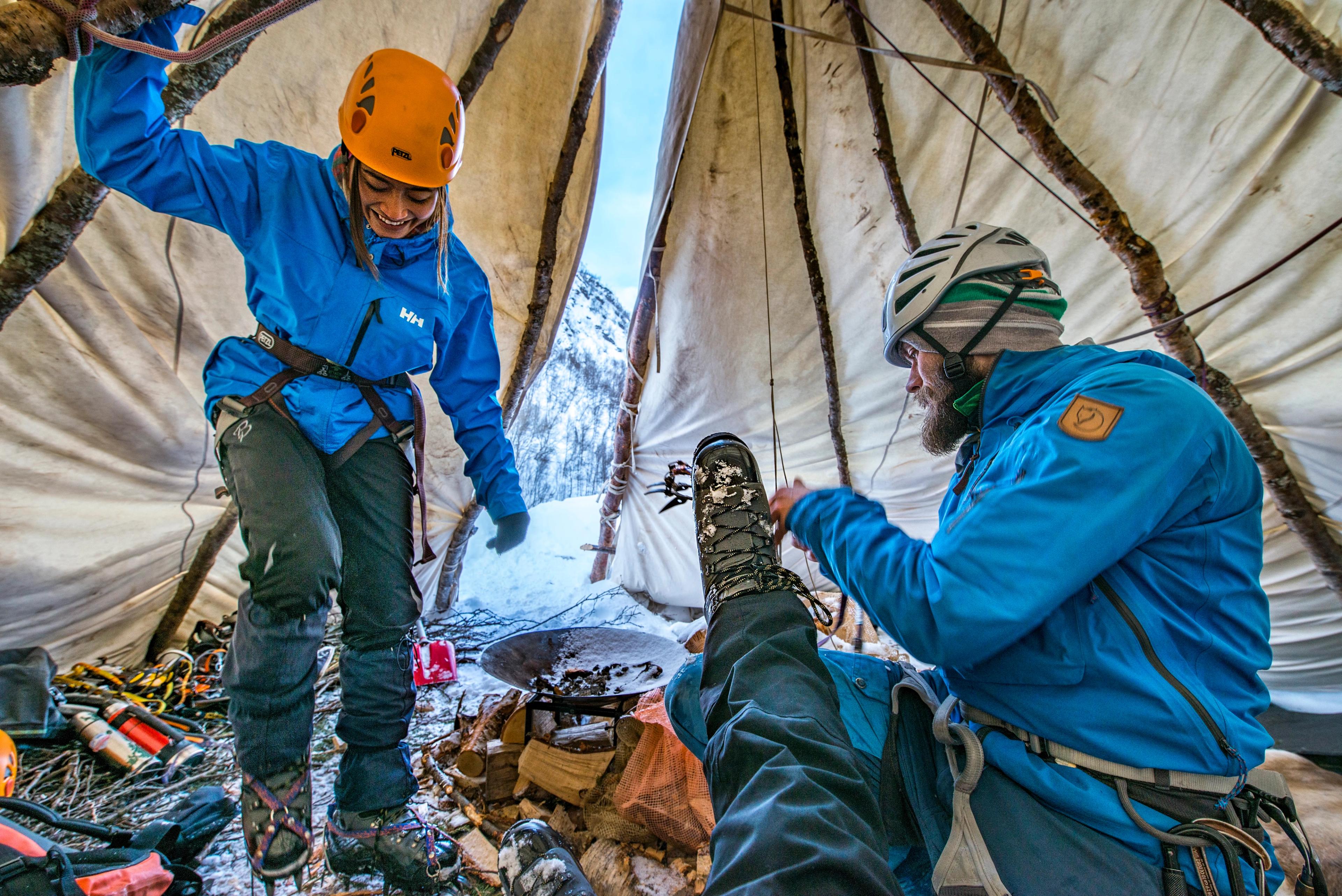 Three iceclimbers in a lavvo