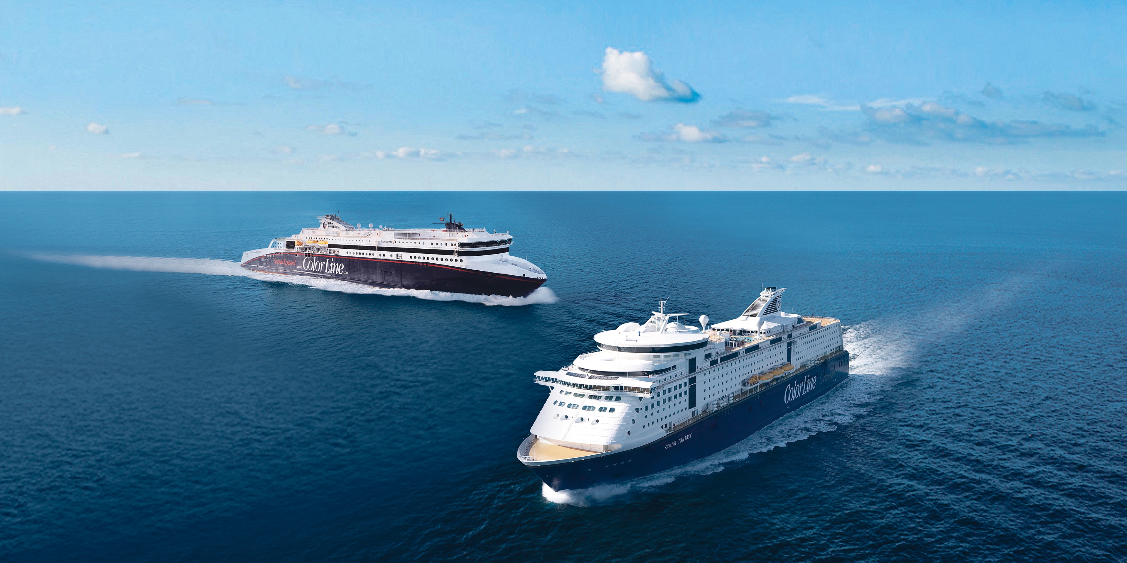 Travel to Norway by ferry: To Color Line ferries crossing paths on the ocean