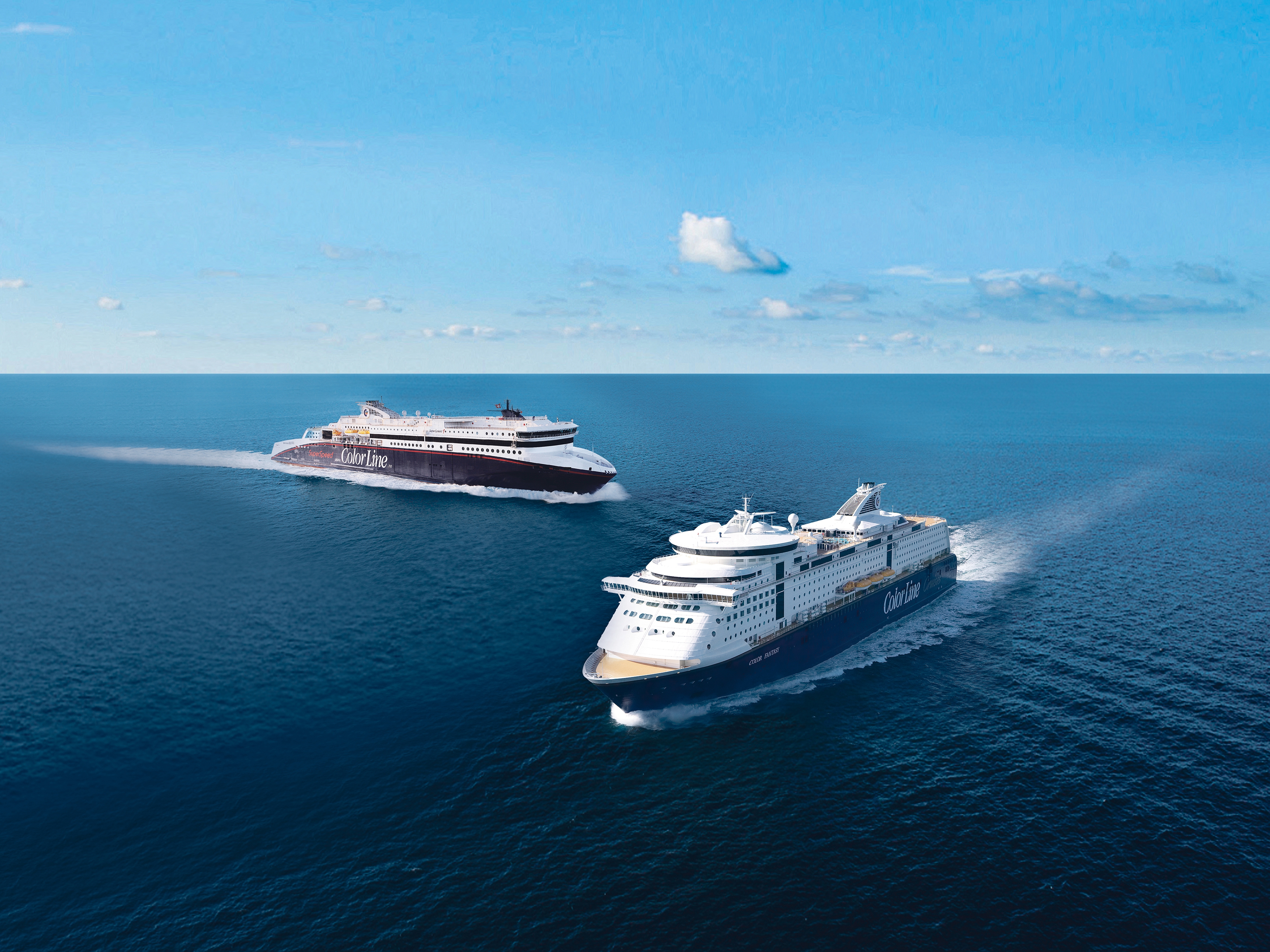 Travel to Norway by ferry: To Color Line ferries crossing paths on the ocean