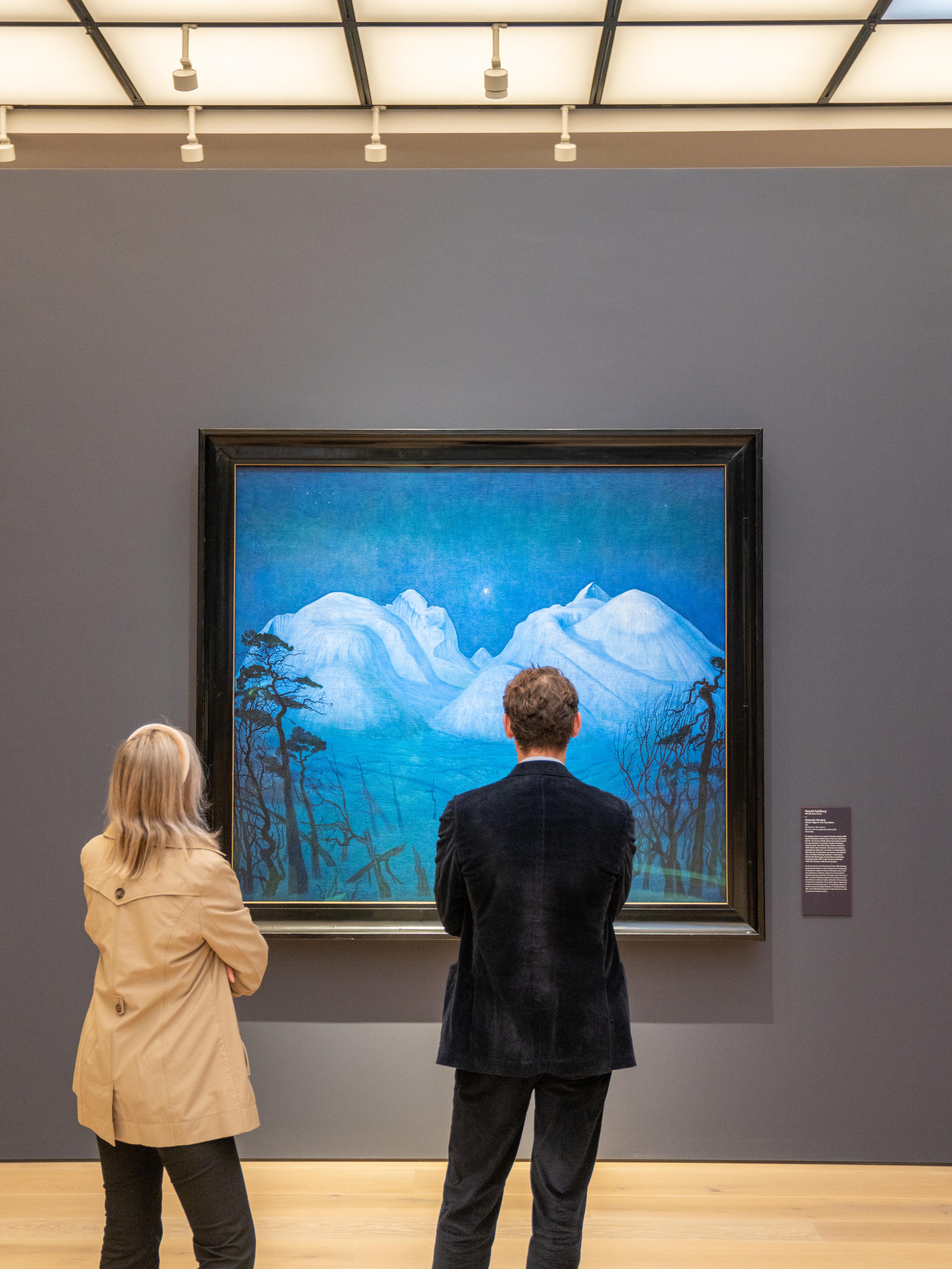People studying "Vinternatt i Rondane" (Winter Night in Rondane) at the National Museum