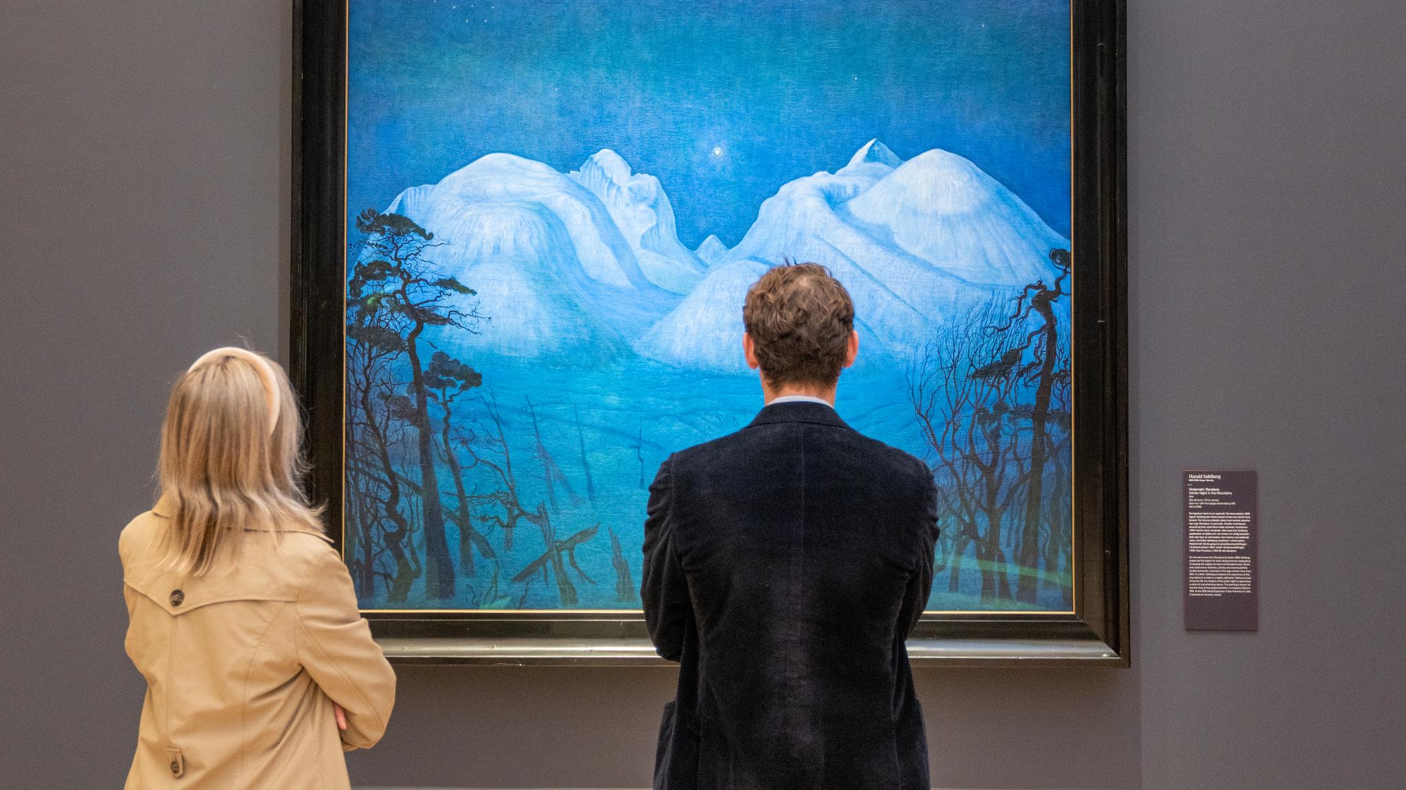 People studying "Vinternatt i Rondane" (Winter Night in Rondane) at the National Museum