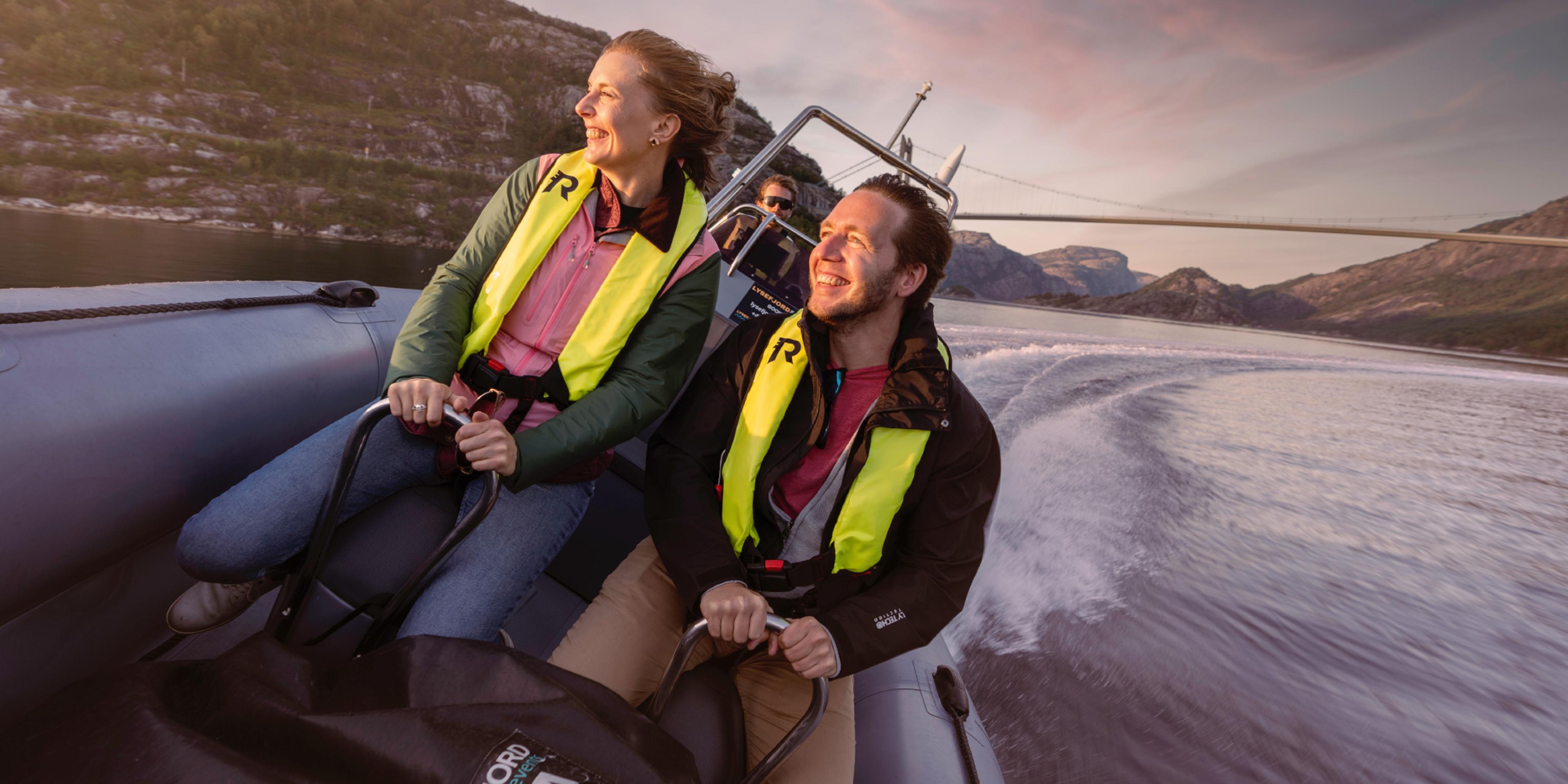 A man and a woman on a RIB boat out on the ocean in Stavanger