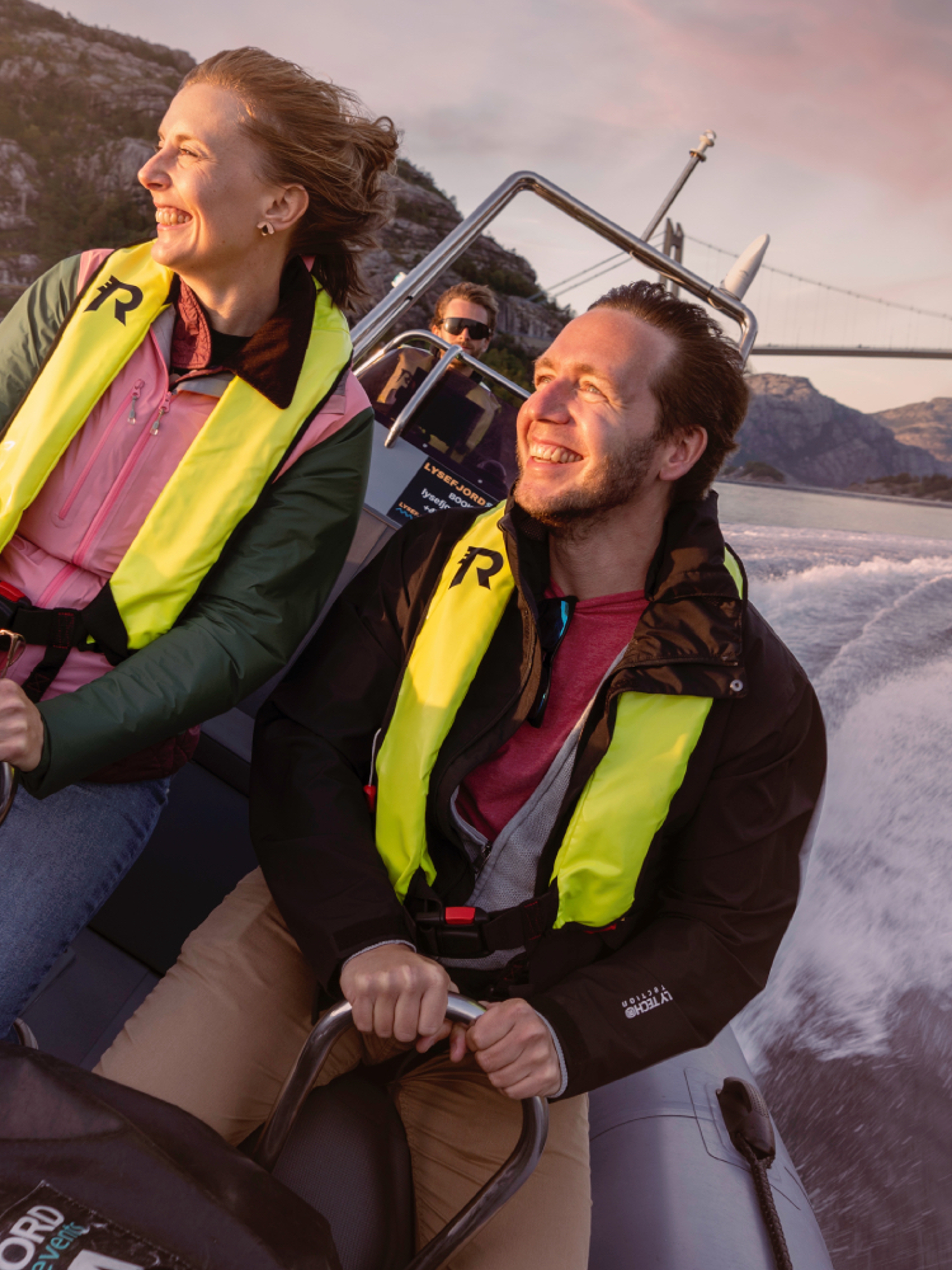 A man and a woman on a RIB boat out on the ocean in Stavanger