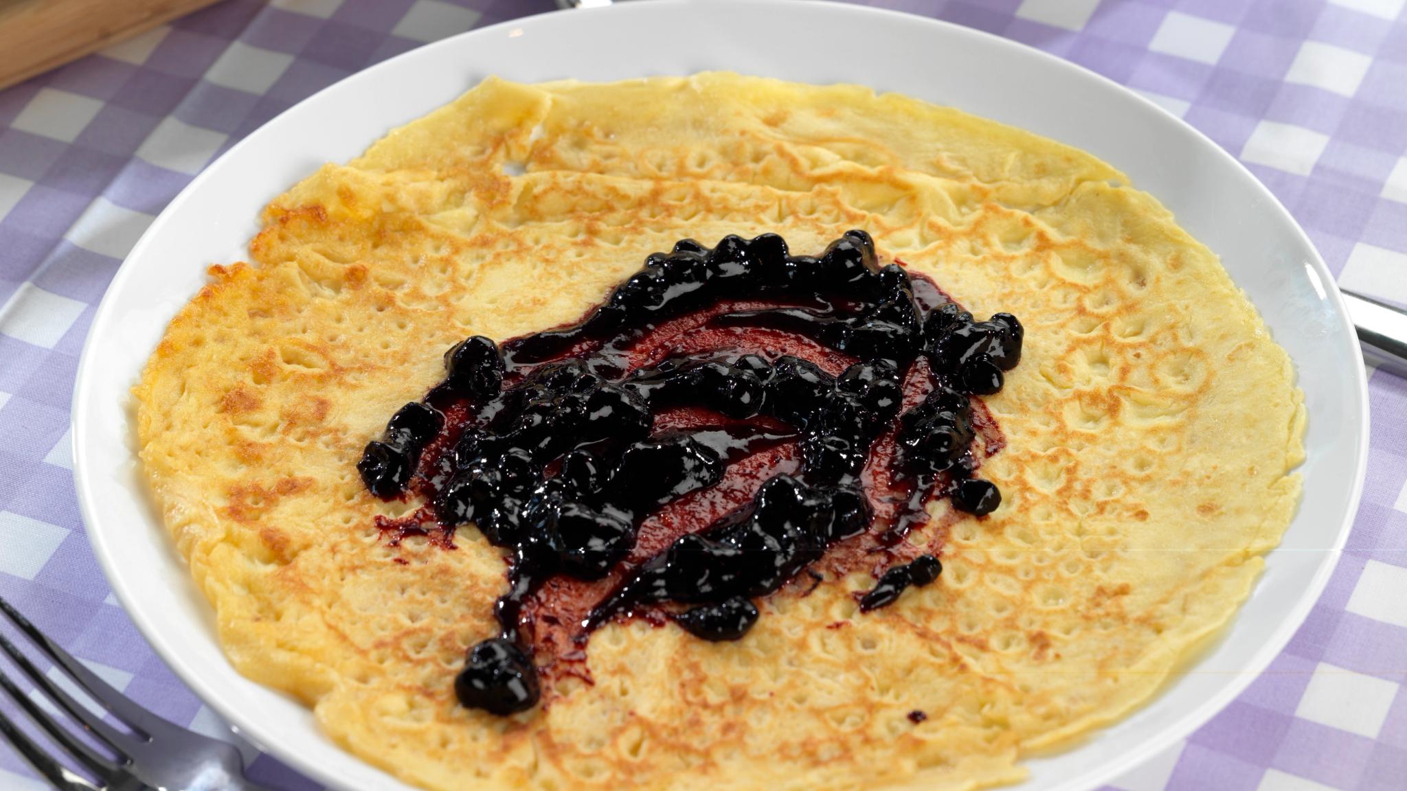 A Norwegian pancake with blueberry jam