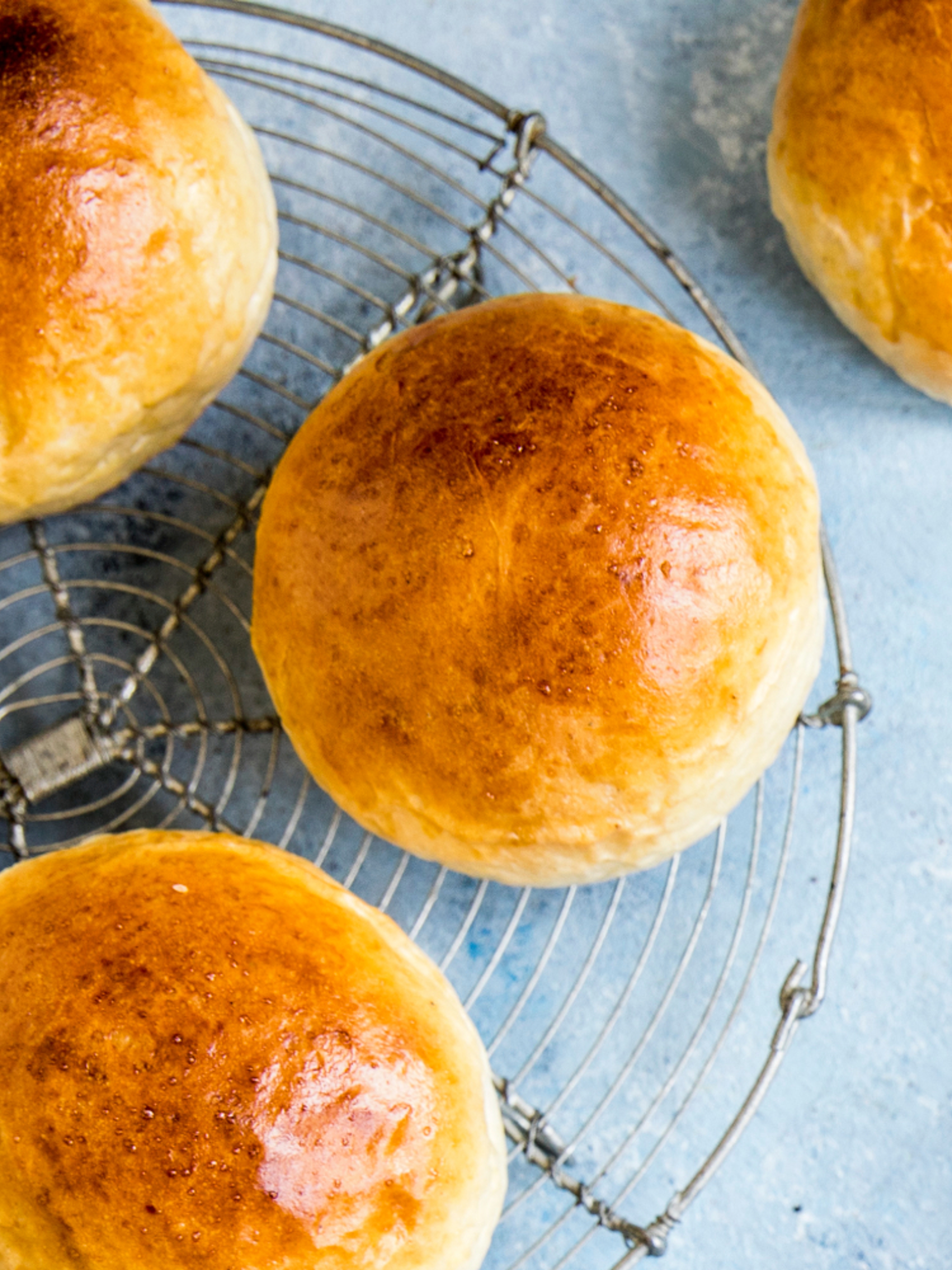 Wheat buns and ingredients on a table