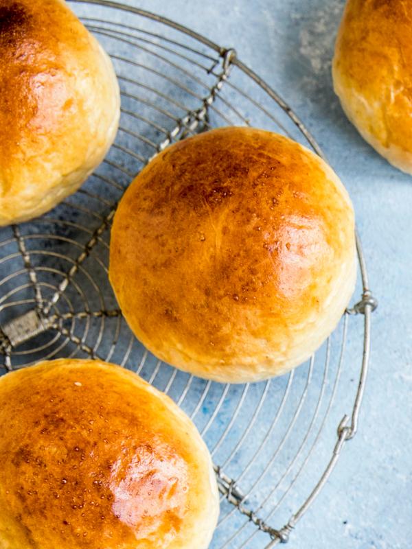 Wheat buns and ingredients on a table