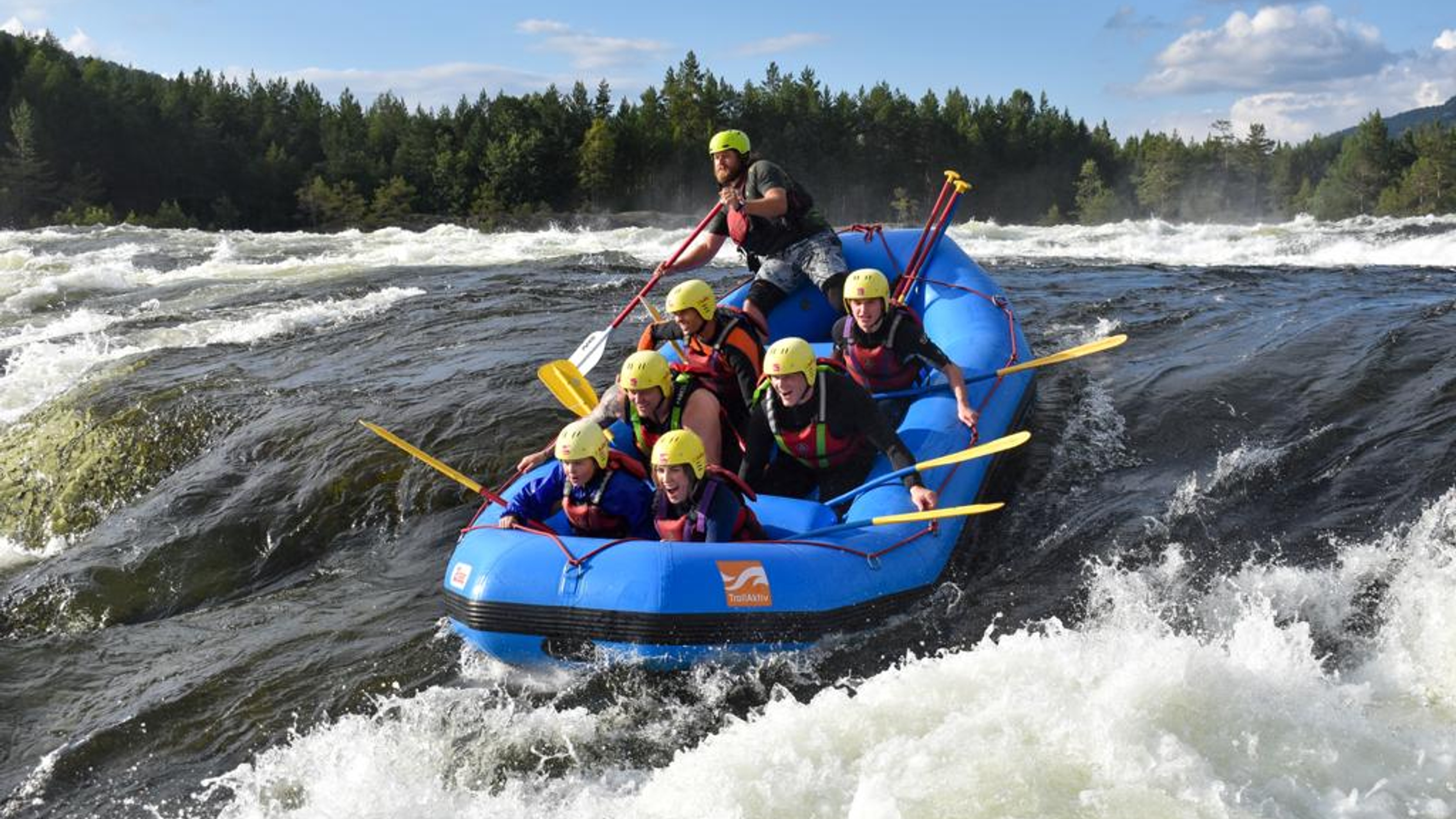 A group of people rafting in Evje in Southern Norway