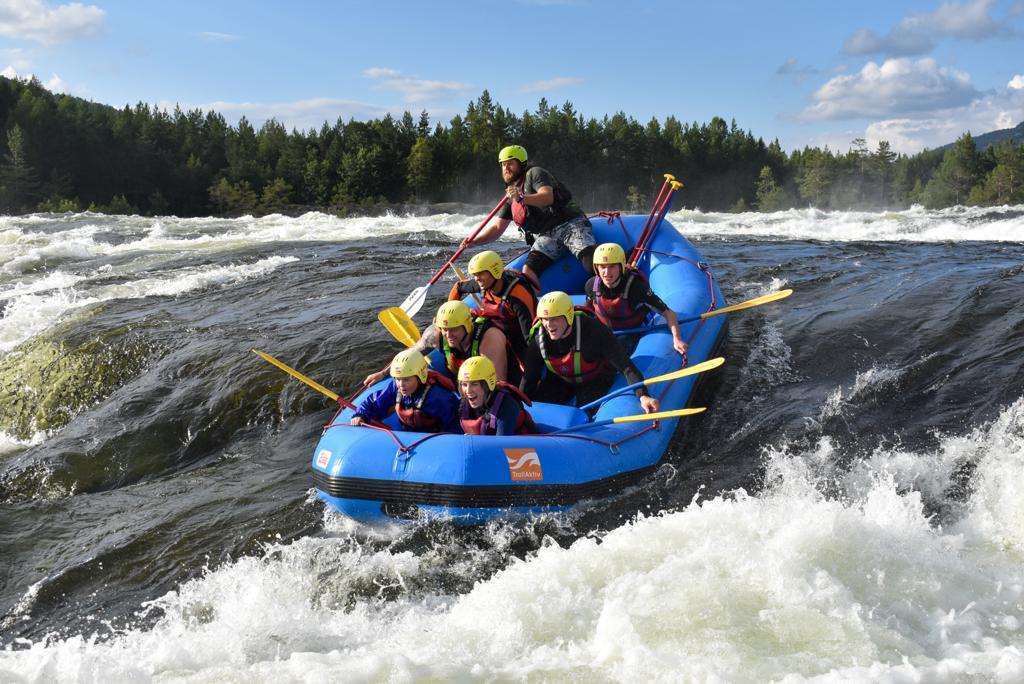 A group of people rafting in Evje in Southern Norway