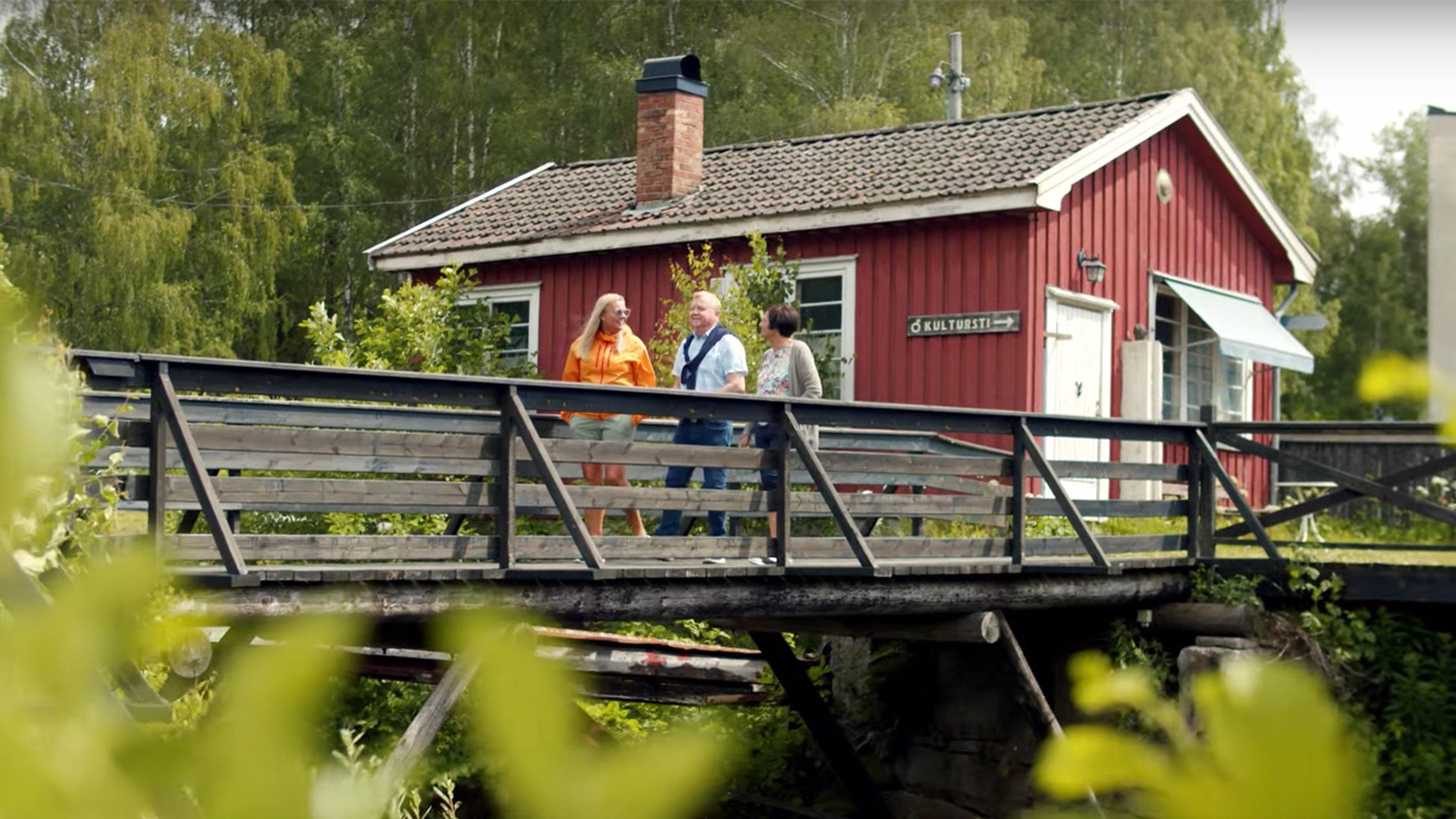 Three friends walking across a bridge in Eidsfoss, Vestfold