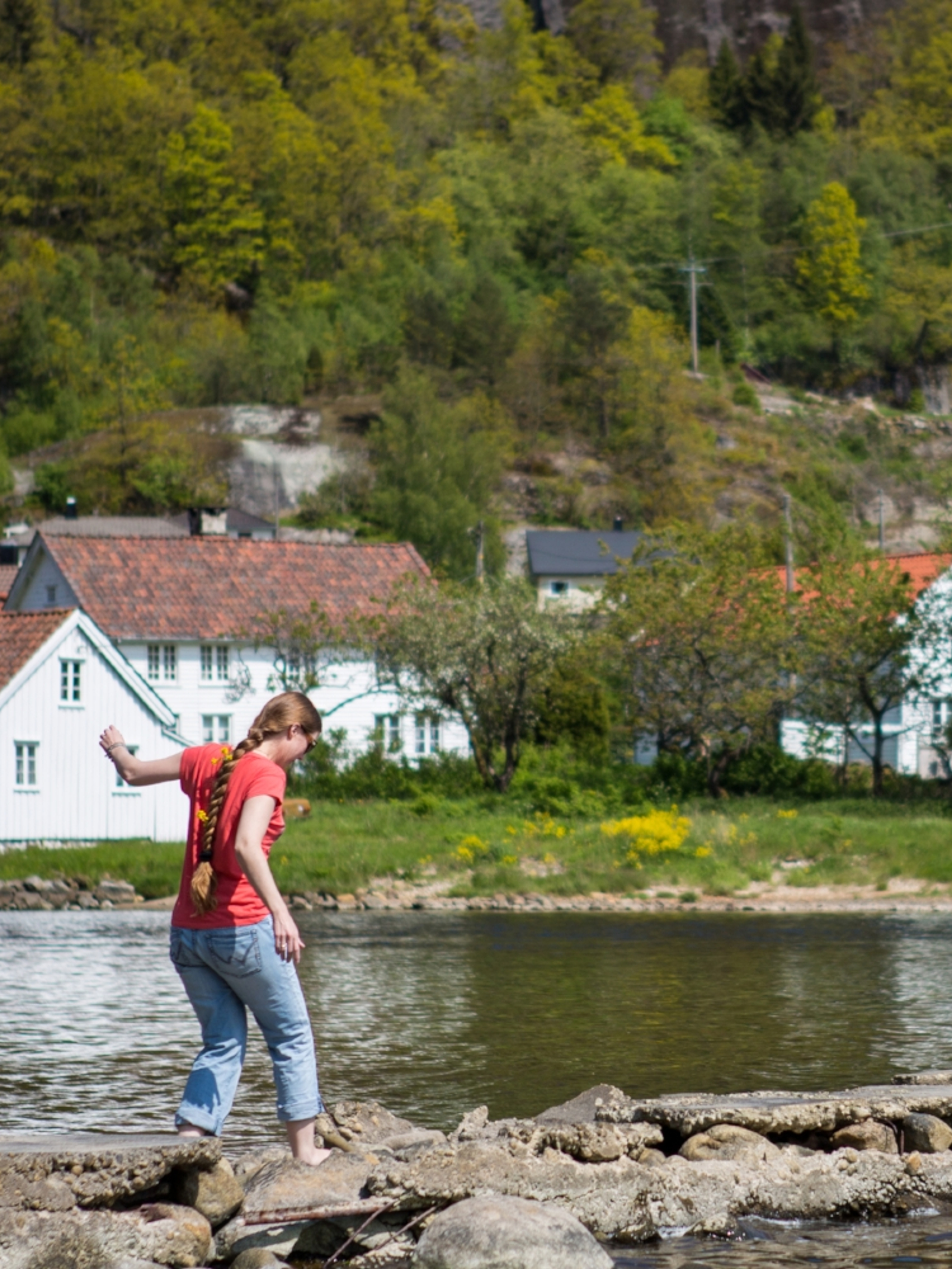 A woman by the fjord in Feda in Kvinesdal, Southern Norway