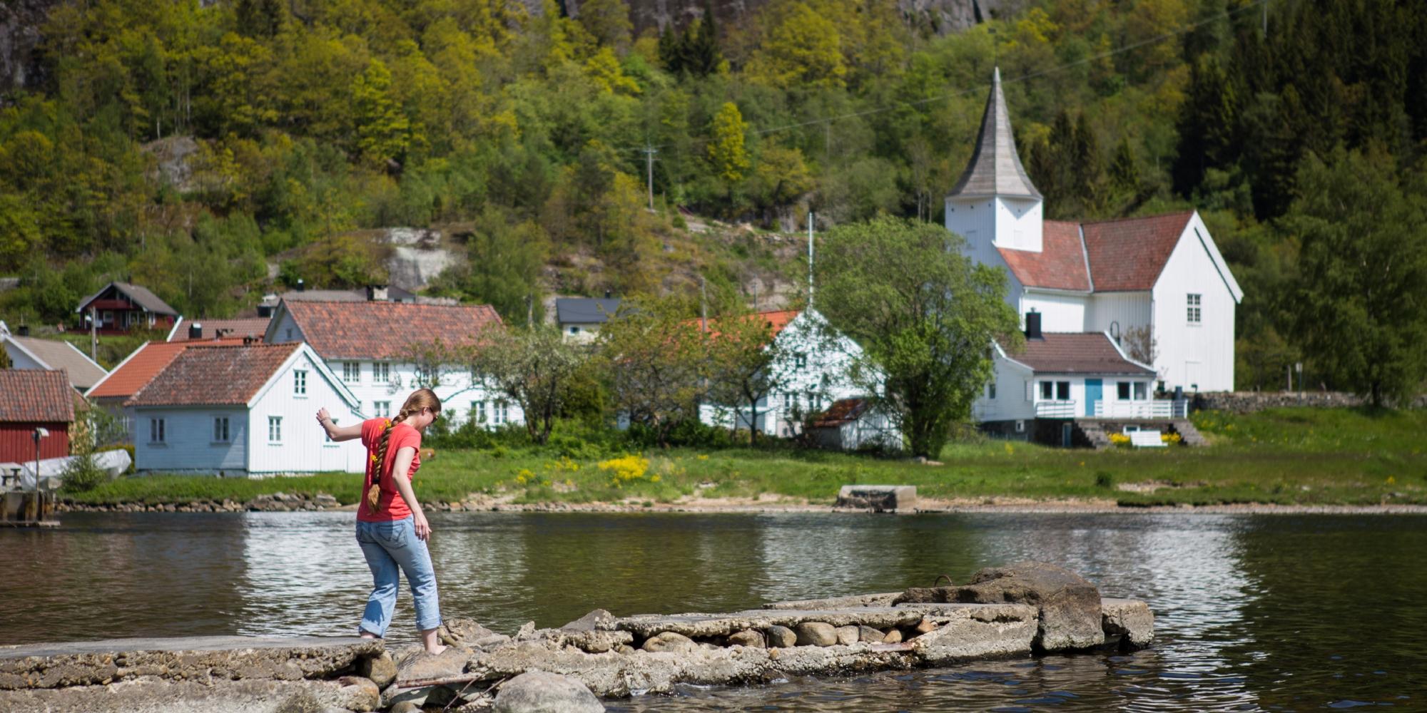 A woman by the fjord in Feda in Kvinesdal, Southern Norway