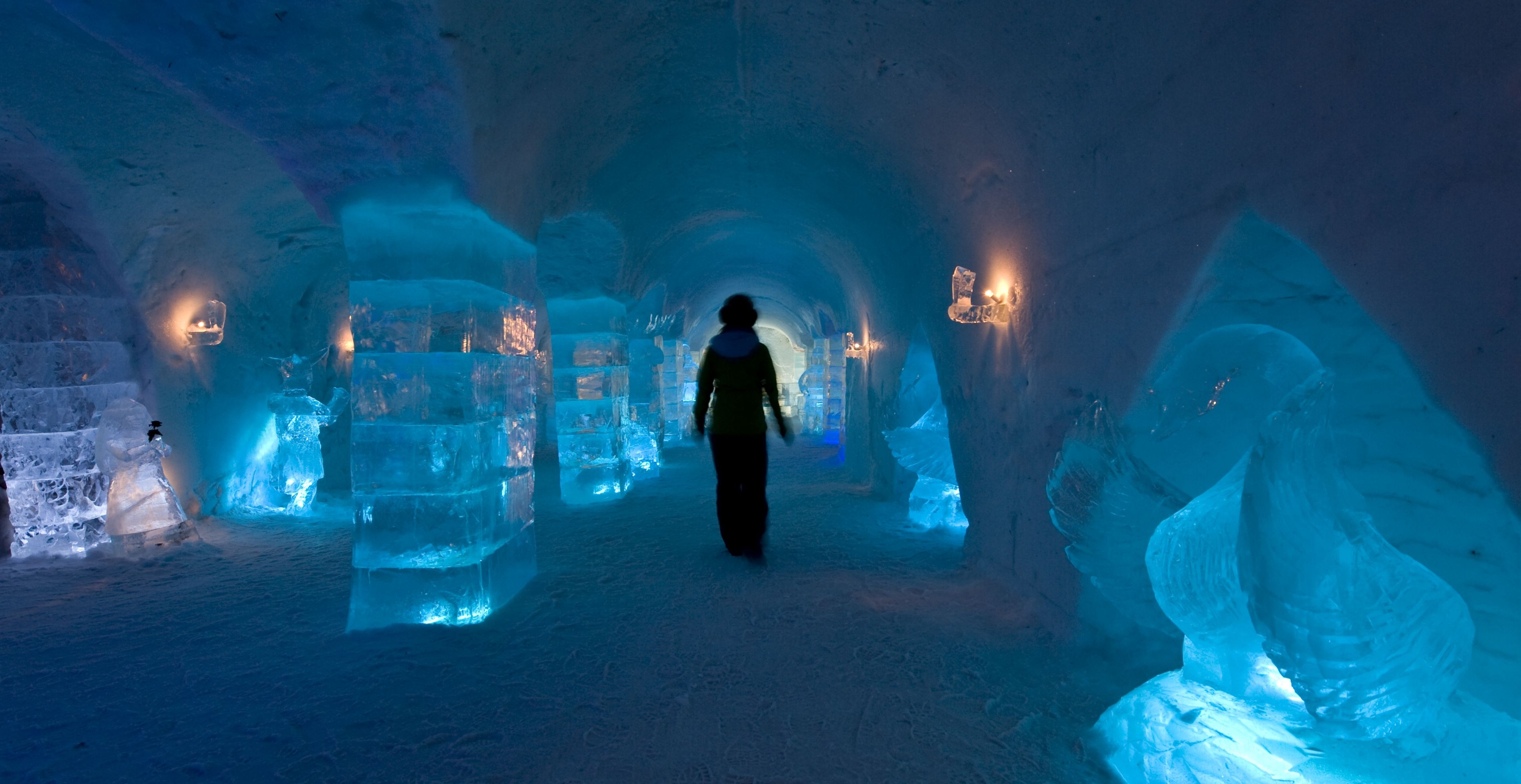 Person inside Sorrisniva Igloo Hotel, in Alta